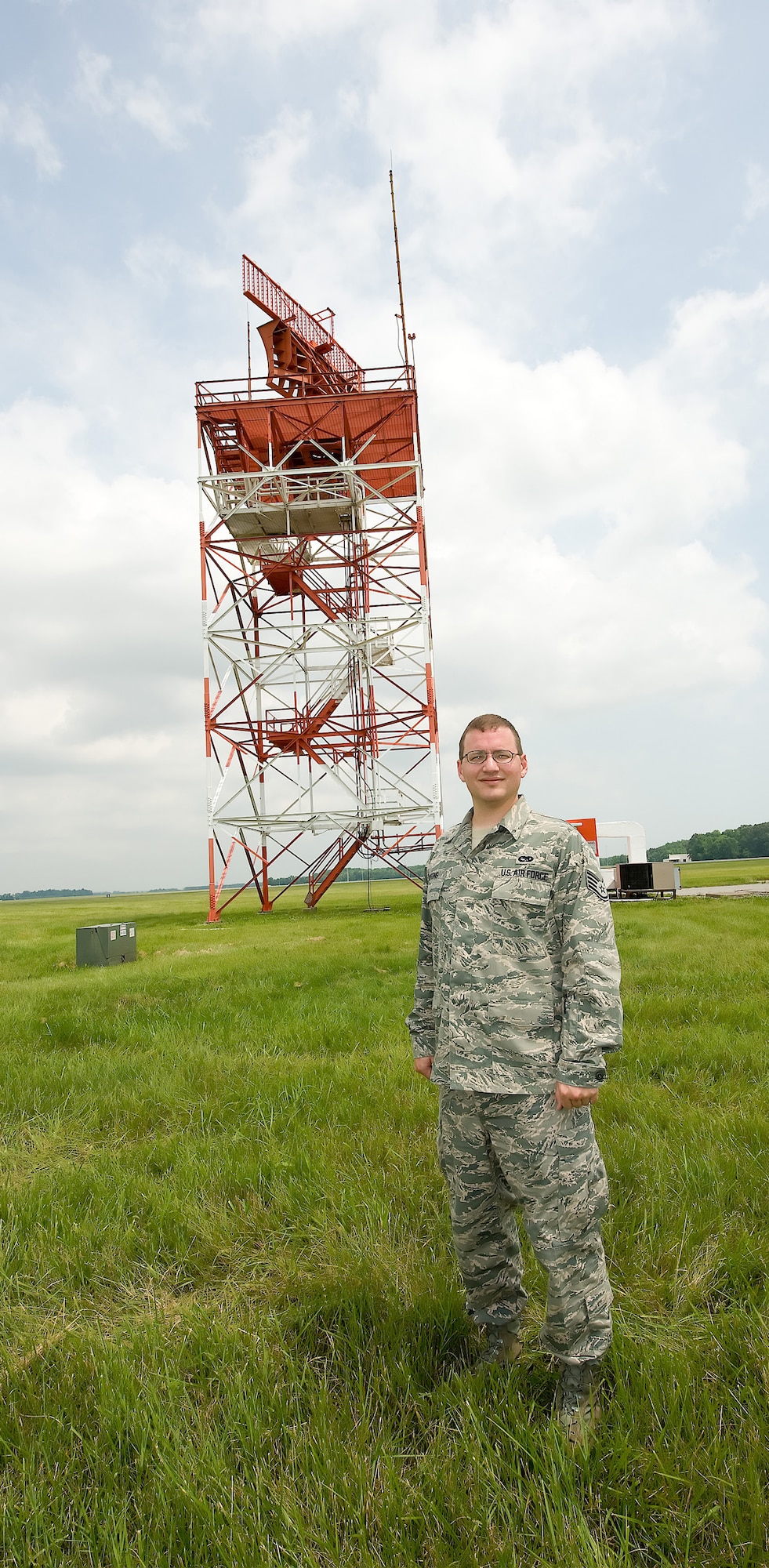 Staff Sgt. Josh Wilfong, 436th Communications Squadron ground radar systems technician, stands in front of the Airport Surveillance Radar. Though the current ASR is more than 30 years old, it efficiently and accurately tracks nearly 200 targets on a daily basis. However, it is slated to be replaced by an advanced ASR. Construction is tentatively scheduled for March 2010. (Air Force photo/ Jason Minto)