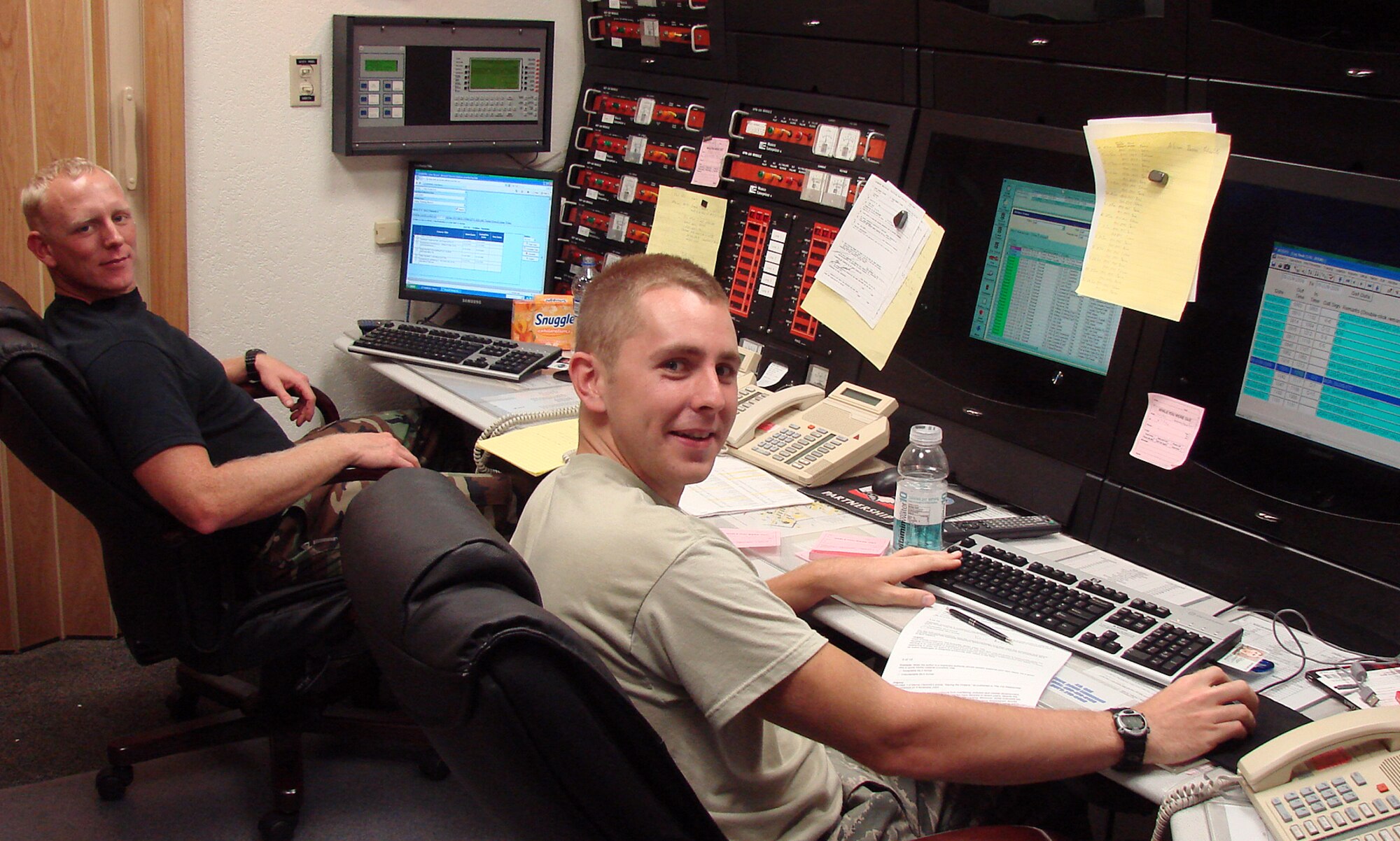 Staff Sgt. Zachary McKinney, left, from the 12th Mission Support Group, Randolph AFB, Texas, and Airman David Sidnam, 56th Civil Engineering Squadron, Luke AFB, Ariz., man the Emergency Communications Center at the Vance Fire Department. They are part of the 31-man team of firefighters deployed to Vance during the labor dispute. (Photo/Senior Master Sgt. Russell Eidenschink)
