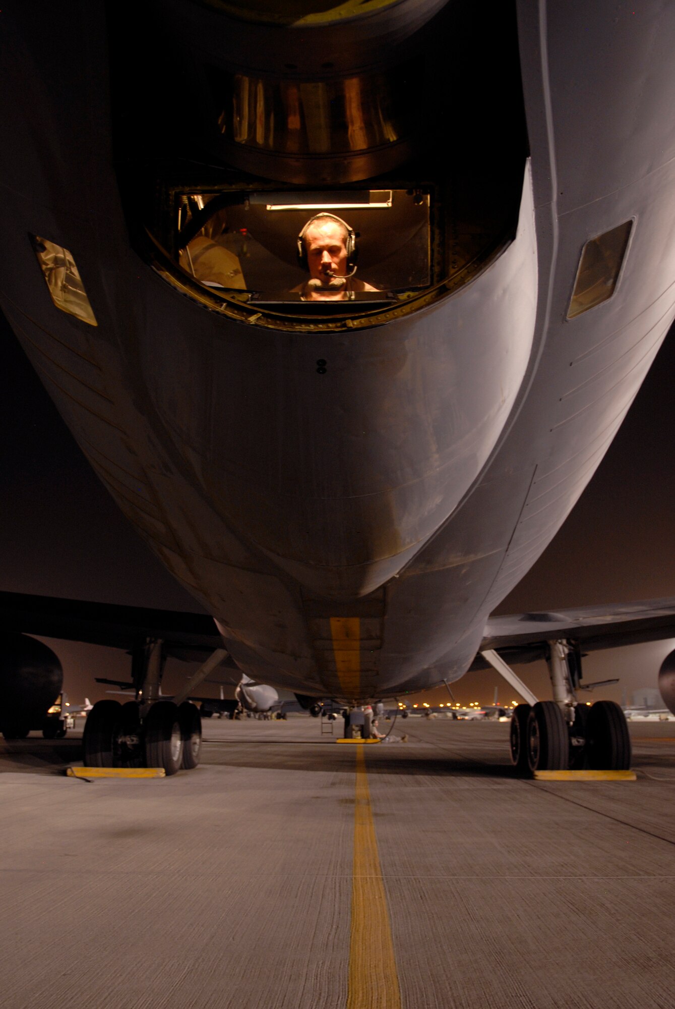 Tech. Sgt. Jake Way, a 340th Expeditionary Air Refueling Squadron boom operator, performs his preflight checks before another mission in a KC-135R Stratotanker, June 21, 2009, at an undisclosed location in Southwest Asia. The KC-135R aircrews support combat operations by performing inflight refueling for combat aircraft supporting servicemembers in operations on the ground in the U.S. Central Command's area of responsibility.  Sergeant Way hails from Meridian, Miss. and is deployed from the 186th Air Refueling Wing, Miss. Air National Guard, in support of Operations Iraqi and Enduring Freedom and Combined Joint Task Force - Horn of Africa.  (U.S. Air Force photo/Senior Airman Andrew Satran/released)