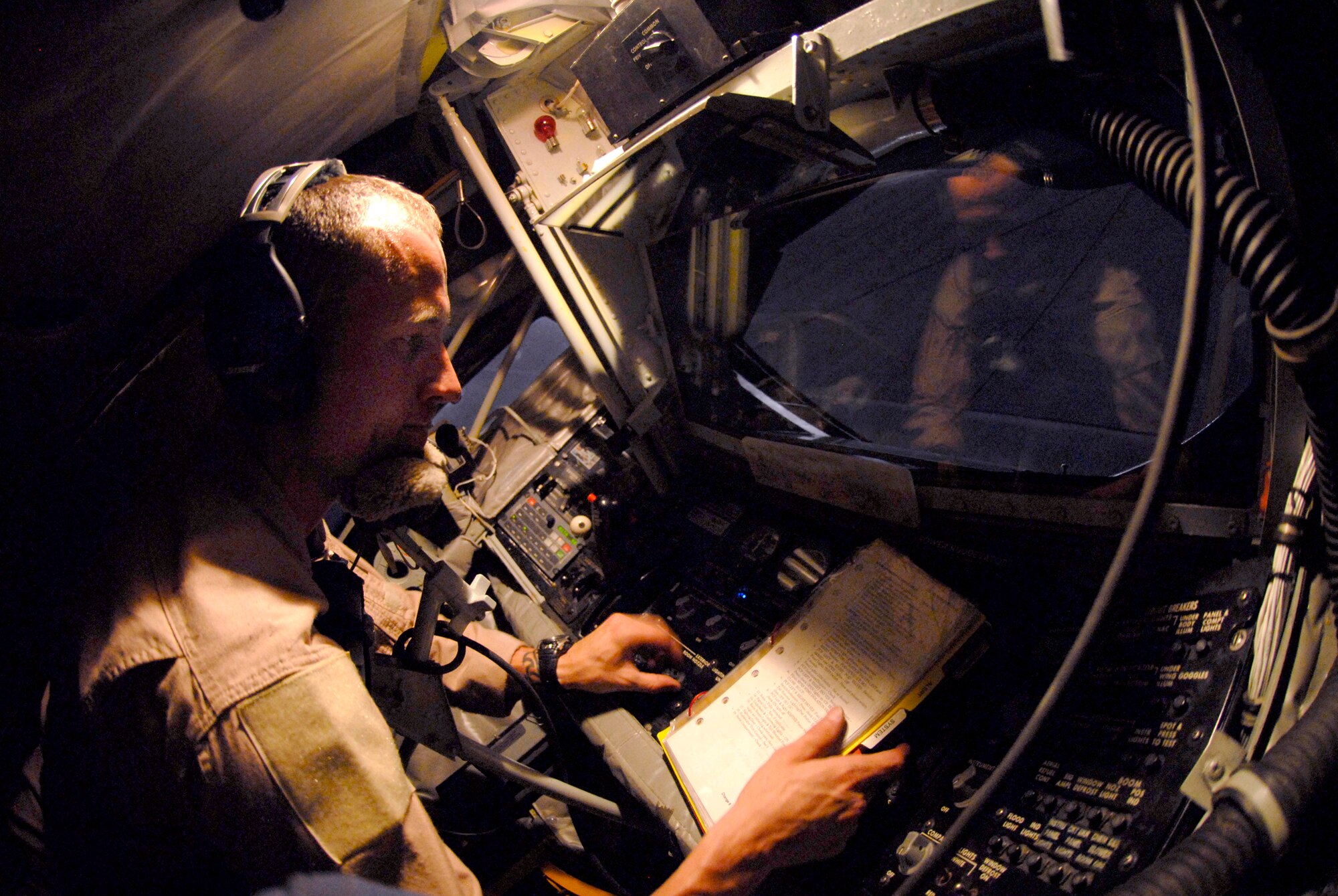 Tech. Sgt. Jake Way, a 340th Expeditionary Air Refueling Squadron boom operator, performs his preflight checks before another mission in a KC-135R Stratotanker, June 21, 2009, at an undisclosed location in Southwest Asia. The KC-135R aircrews support combat operations by performing inflight refueling for combat aircraft supporting servicemembers in operations on the ground in the U.S. Central Command's area of responsibility.  Sergeant Way hails from Meridian, Miss. and is deployed from the 186th Air Refueling Wing, Miss. Air National Guard, in support of Operations Iraqi and Enduring Freedom and Combined Joint Task Force - Horn of Africa.  (U.S. Air Force photo/Senior Airman Andrew Satran/released)