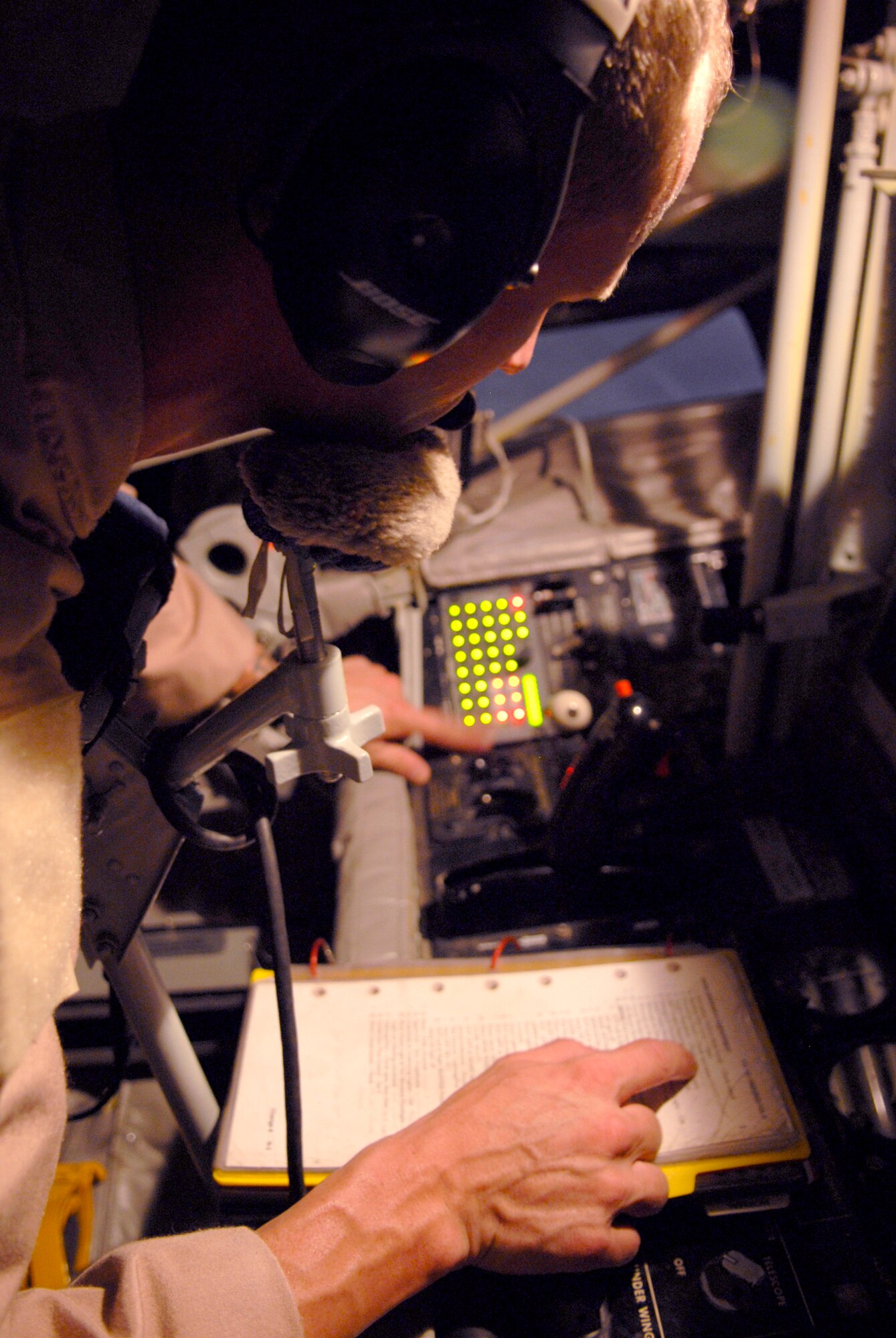 Tech. Sgt. Jake Way, a 340th Expeditionary Air Refueling Squadron boom operator, performs his preflight checks before another mission in a KC-135R Stratotanker, June 21, 2009, at an undisclosed location in Southwest Asia. The KC-135R aircrews support combat operations by performing inflight refueling for combat aircraft supporting servicemembers in operations on the ground in the U.S. Central Command's area of responsibility.  Sergeant Way hails from Meridian, Miss. and is deployed from the 186th Air Refueling Wing, Miss. Air National Guard, in support of Operations Iraqi and Enduring Freedom and Combined Joint Task Force - Horn of Africa.  (U.S. Air Force photo/Senior Airman Andrew Satran/released)