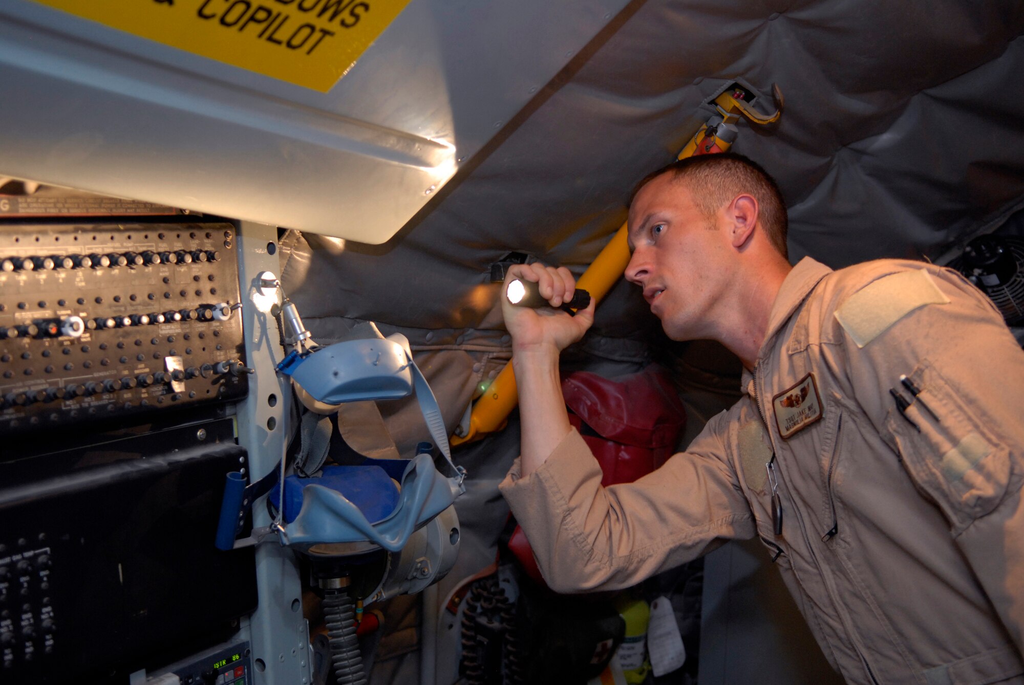 Tech. Sgt. Jake Way, a 340th Expeditionary Air Refueling Squadron boom operator, performs his preflight checks on a circuit breaker panel before another mission in a KC-135R Stratotanker, June 21, 2009, at an undisclosed location in Southwest Asia. The KC-135R aircrews support combat operations by performing inflight refueling for combat aircraft supporting servicemembers in operations on the ground in the U.S. Central Command's area of responsibility.  Sergeant Way hails from Meridian, Miss. and is deployed from the 186th Air Refueling Wing, Miss. Air National Guard, in support of Operations Iraqi and Enduring Freedom and Combined Joint Task Force - Horn of Africa.  (U.S. Air Force photo/Senior Airman Andrew Satran/released)