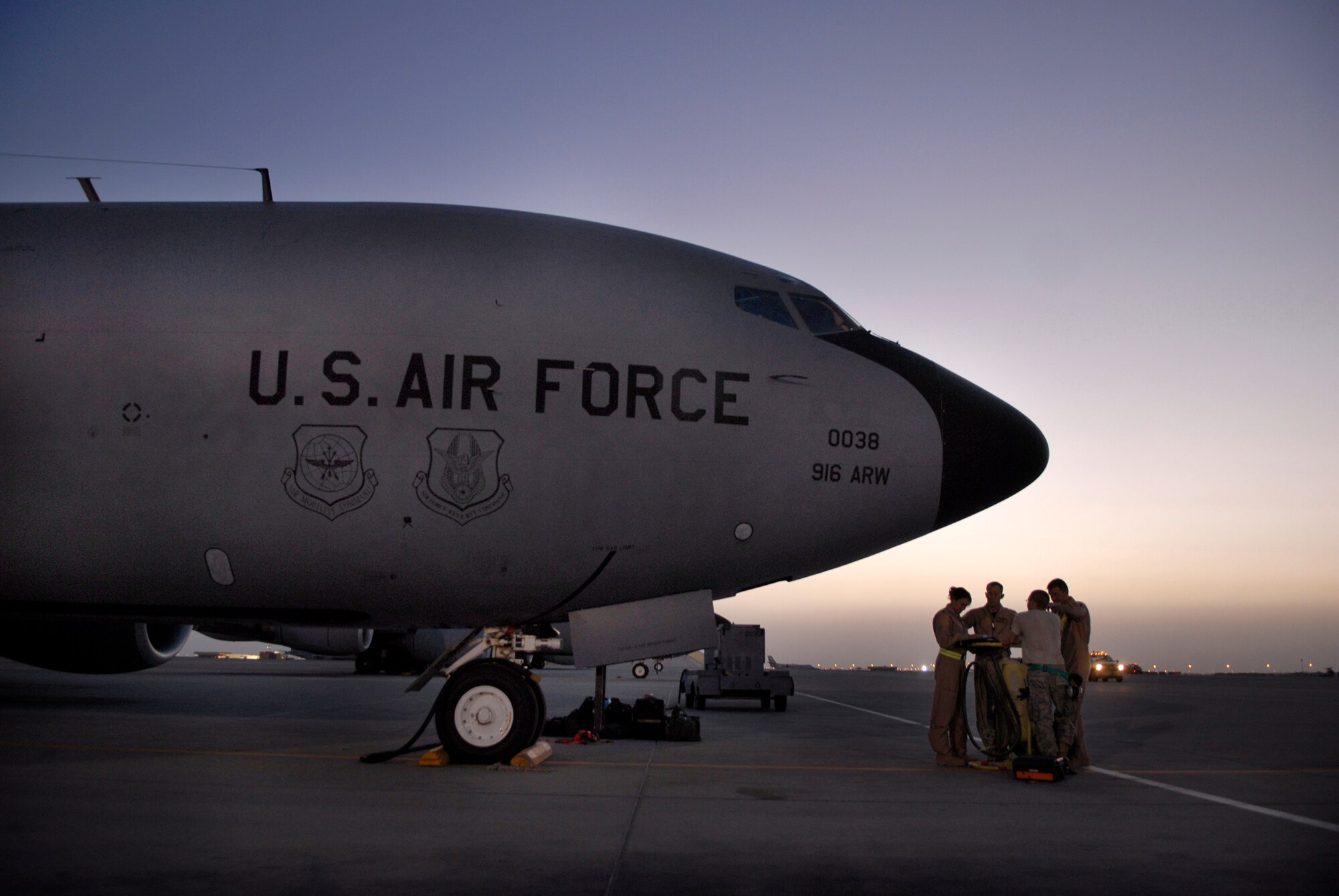 A 340th Expeditionary Air Refueling Squadron KC-135R Stratotanker aircrew holds a preflight briefing in front of their aircraft before starting the preflight checks, June 21, 2009, at an undisclosed location in Southwest Asia.  The KC-135R aircrews support combat operations by performing in-flight refueling for combat aircraft supporting servicemembers in operations on the ground in the U.S. Central Command's area of responsibility.  The aircrew is deployed here in support of Operations Iraqi and Enduring Freedom and Combined Joint Task Force - Horn of Africa.  (U.S. Air Force photo/Senior Airman Andrew Satran/released)