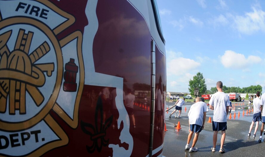 BARKSDALE AIR FORCE BASE, La. -- Airmen from the Mission Support Group participate in Barksdale’s annual Fire Muster June 12. A fire muster is a fire department competition consisting of several events. These activities resemble training the Air Force firefighters use to keep their lifesaving skills sharp. (U.S. photo/Airman 1st Class Brittany Y. Bateman)
