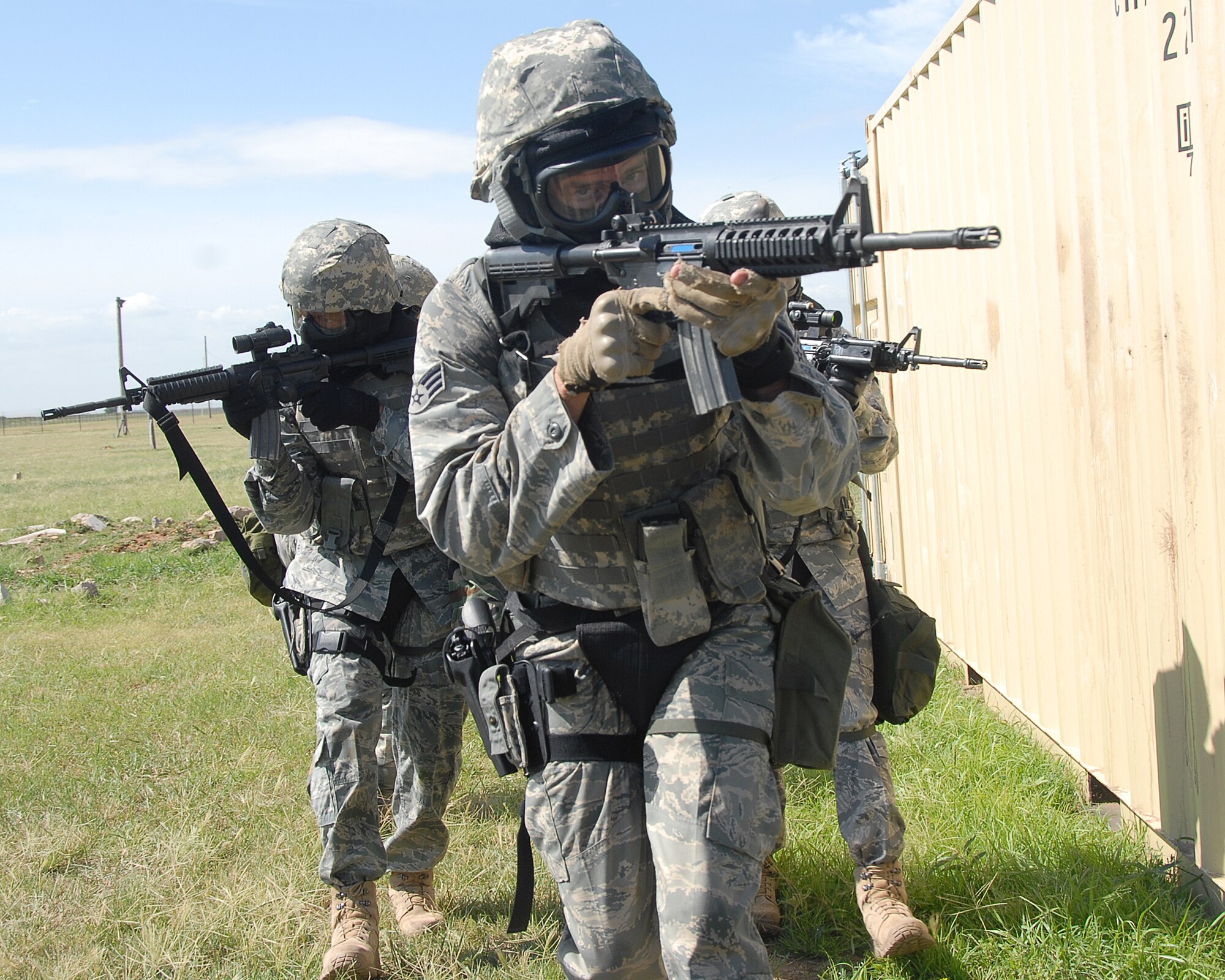 ALTUS AIR FORCE BASE, Okla. --Senior Airman Christopher Laberge, 97 Security Forces, leads his team as they protect a simulated rescued hostage. Airman Laberge is one of the five Rodeo team members for Security Forces. Security Forces members Air Force wide will compete at McChord AFB, Wash. July 19-25 in combat endurance, weapons and tactics. (U.S. Air Force photo by Airman 1st Class Leandra D Hernandez)