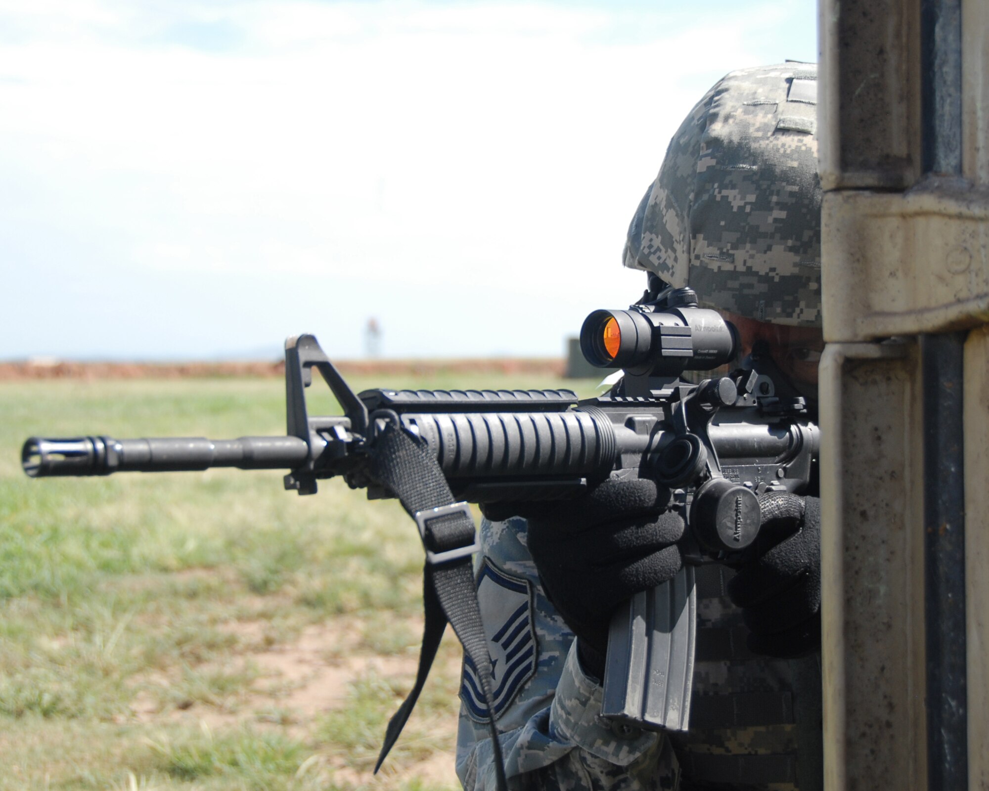 ALTUS AIR FORCE BASE, Okla.-- Master Sgt. Daniel Kille, 97 Security Forces Squadron, "scopes" for bad guys as he and his four-man team prepare to clear a building. Sergeant Kille is the team leader for the Altus SFS Rodeo Team. The team will meet at McChord AFB, Wash. July 19-25 to compete against Security Forces Squadrons Air Force wide. (U.S. Air Force photo by Airman 1st Class Leandra D Hernandez)