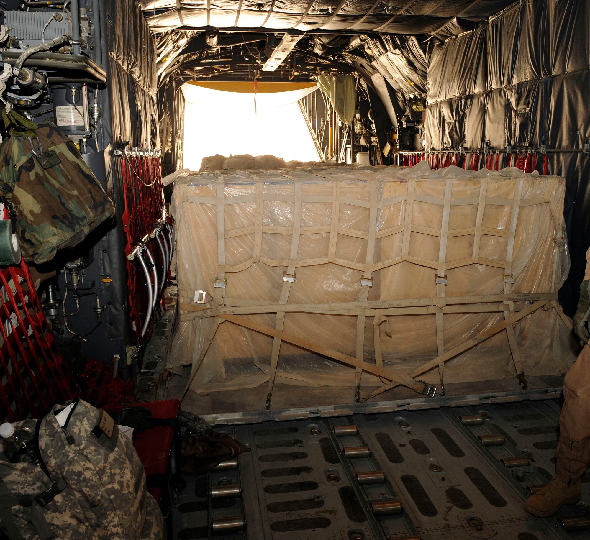 Three pallets of humanitarian aid awaits for pickup, transportation and delivery at Najaf, Iraq June 21, 2009. The flight was scheduled to drop off the aid and donated supplies to displaced families at Camp Al-Manathera.  (U.S. Air Force photo by Senior Airman Jacqueline Romero) 