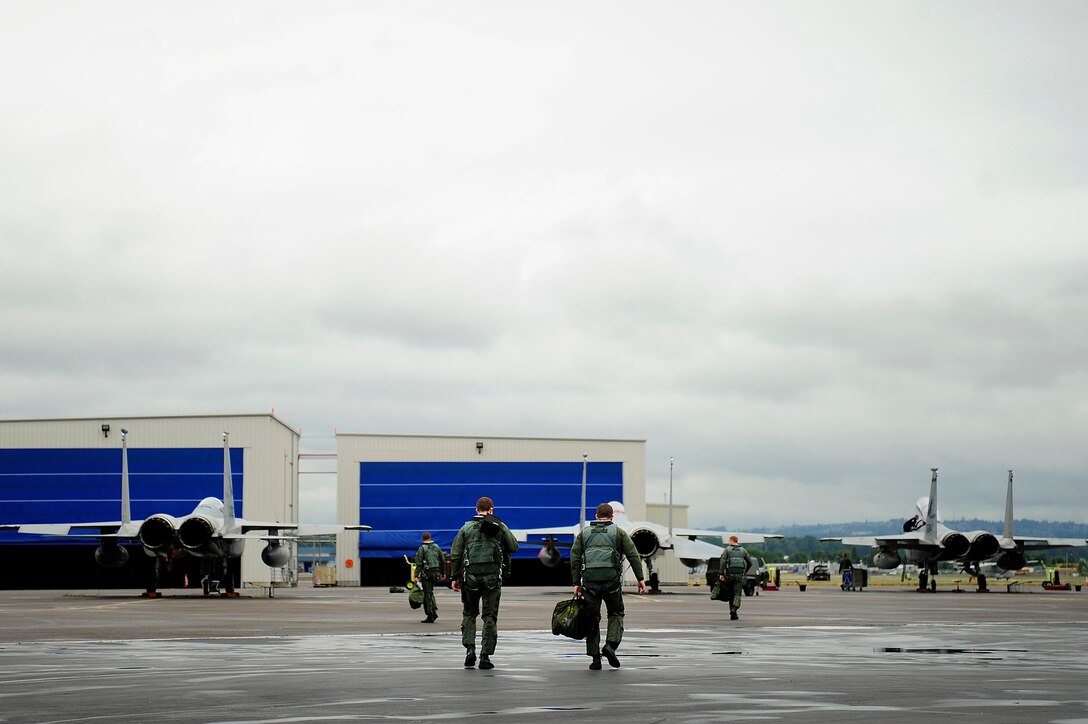 F-15 Eagle pilots from the 142nd Fighter Wing, Portland Air National Guard Base, Ore., step to their aircraft before flying a mission in support of Amalgam Dart 2009, June 19. Amalgam Dart is a field test of the Department of Defense's ability to rapidly deploy a total air integrated defense system in the U.S. in order to deter, detect and defeat airborne threats. (U.S. Air Force photo by Staff Sgt. Jacob N. Bailey)