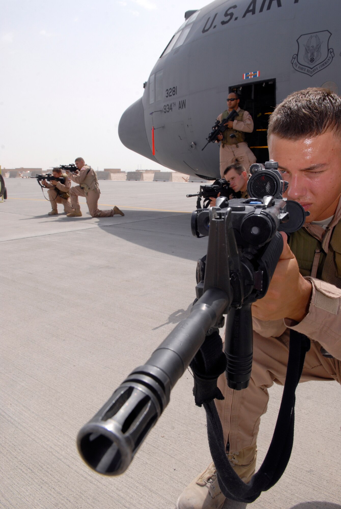 Airman 1st Class Avery Ward, 379th Expeditionary Security Forces Squadron (ESFS) fly away security team (FAST) member, provides security for a C-130 with his other team members during a training exercise, June 18, 2009, at an undisclosed location in Southwest Asia.  The FAST team provides security for all airlift assets operating in the U.S. Central Command's area of responsibility, where additional security is needed at unsecure locations.  Airman Ward hails from Lake Charles, La. and is deployed from Eielson Air Force Base, Alaska.  The FAST team is deployed here in support of Operations Iraqi and Enduring Freedom and Combined Joint Task Force - Horn of Africa.  (U.S. Air Force photo/Senior Airman Andrew Satran/released)   