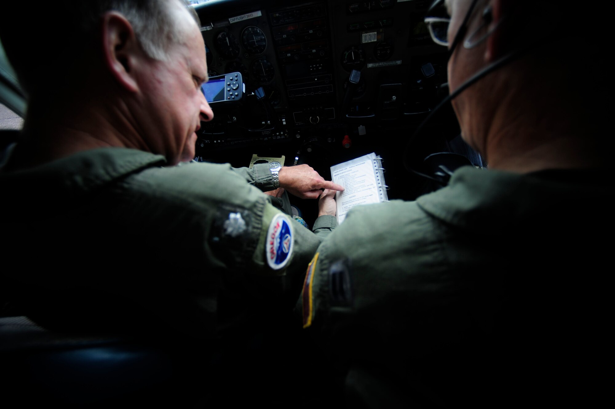 Lt. Col. Wayne Schulz (left) and Capt. John Barringer, U.S. Air Force Auxiliary, Civil Air Patrol, conduct preflight checks in a C-182 Cessna before departing Astoria, Ore. during Amalgam Dart 2009, June 18. Amalgam Dart is a field test of the Department of Defense's ability to rapidly deploy a total air integrated defense system in the U.S. in order to deter, detect and defeat airborne threats. (U.S. Air Force photo by Staff Sgt. Jacob N. Bailey)