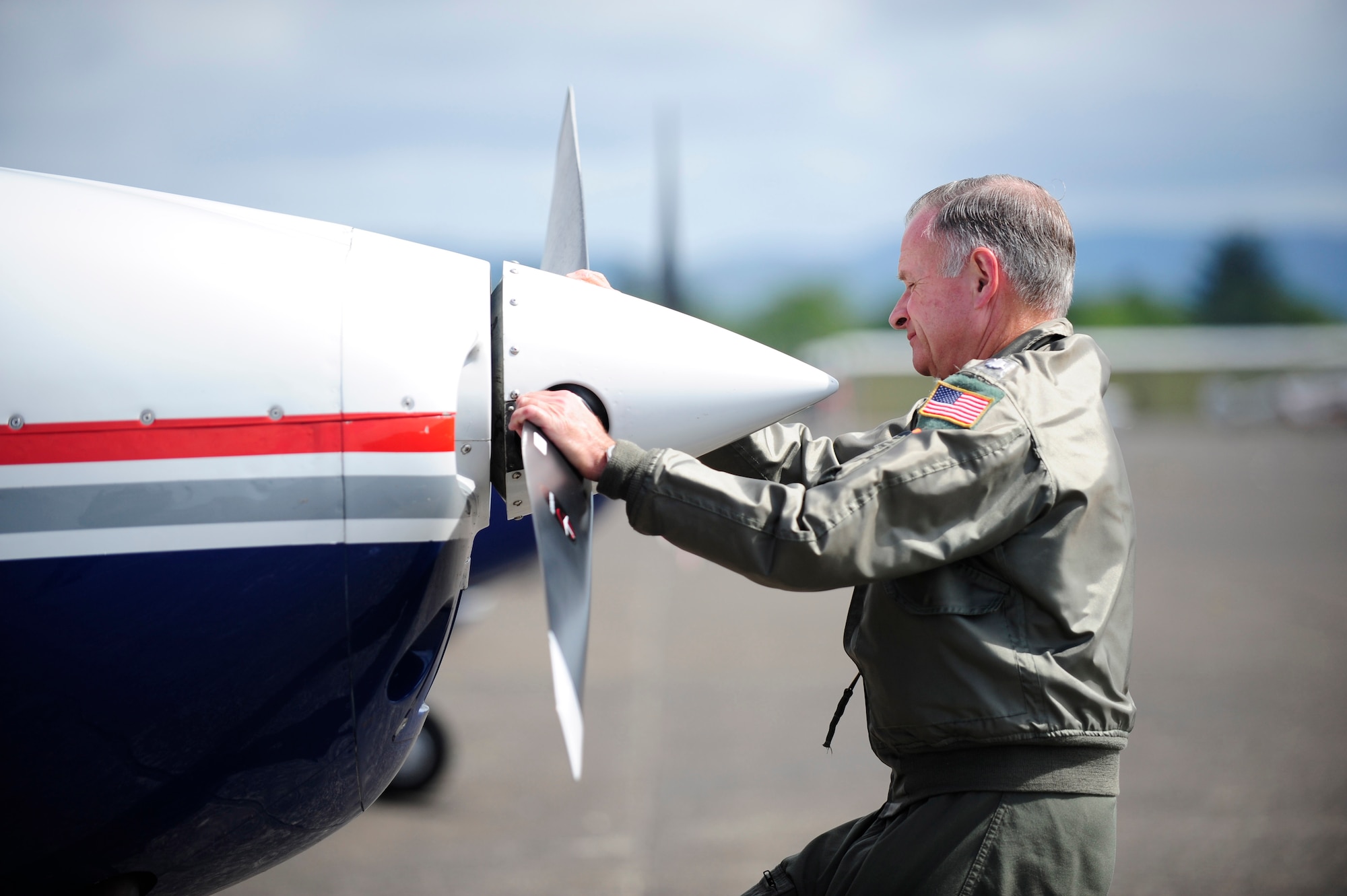 Lt. Col. Wayne Schulz, U.S. Air Force Auxiliary, Civil Air Patrol, conducts preflight checks on a C-182 Cessna before departing Astoria, Ore., during Amalgam Dart 2009, June 18. Amalgam Dart is a field test of the Department of Defense's ability to rapidly deploy a total air integrated defense system in the U.S. in order to deter, detect and defeat airborne threats. (U.S. Air Force photo by Staff Sgt. Jacob N. Bailey)