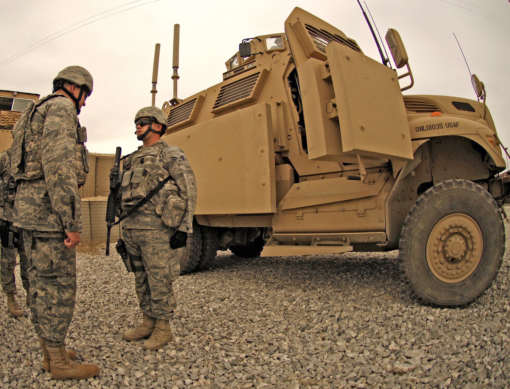 BAGRAM AIR FIELD, Afghanistan - Senior Airman Andrew Varey, 455th Expeditionary Security Forces Squadron, delivers a post briefing to Lt. Gen. Gary North, U.S. Air Forces Central and 9th Air Force commander, during a visit to one of Bagram's entry control points June 16. General North visited and spoke with hundreds of Airmen as he prepares for his final month as commander after serving more than three years. (Air Force/Staff Sgt. Jason Lake)