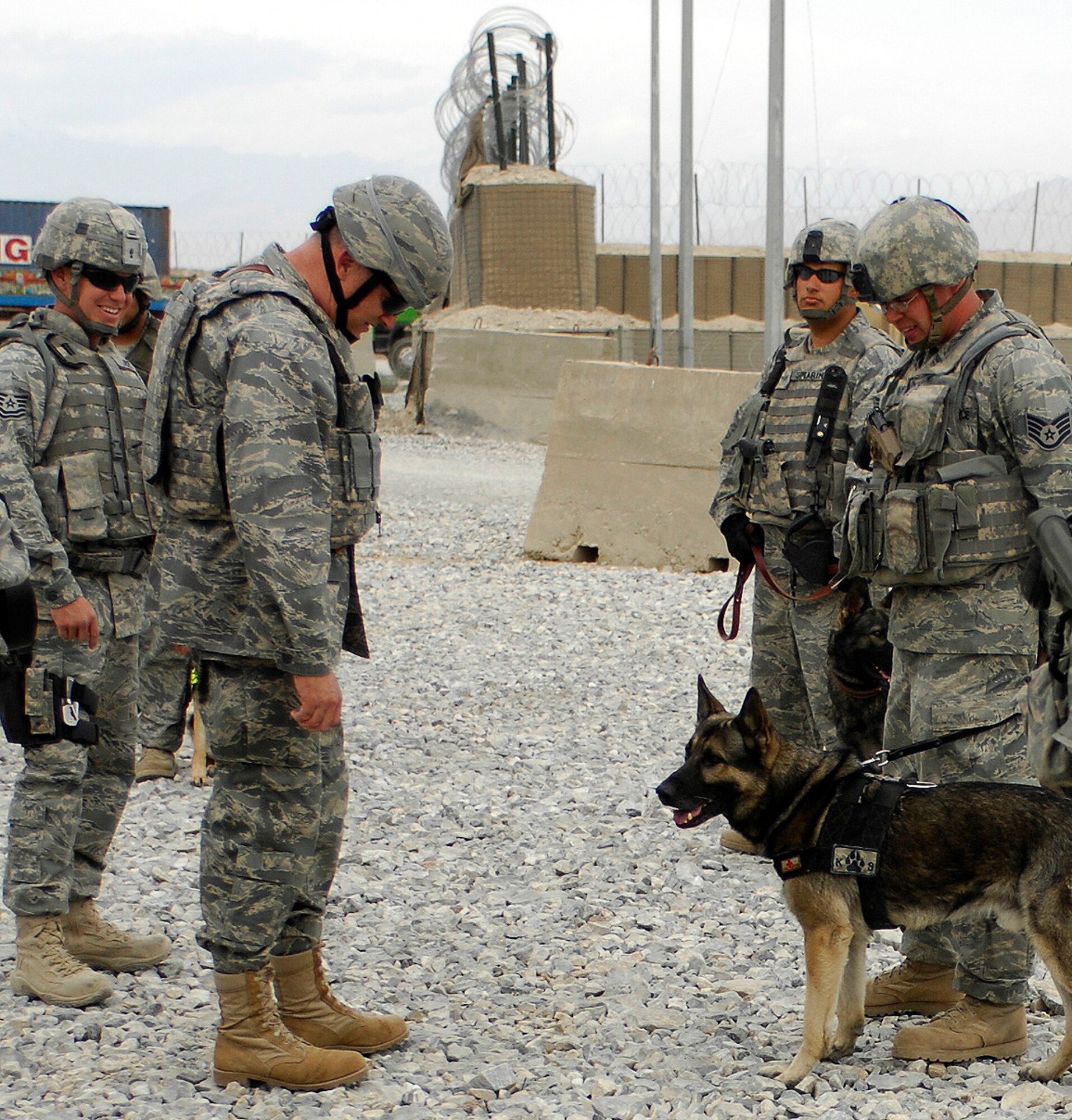 BAGRAM AIR FIELD, Afghanistan - Lt. Gen. Gary North, U.S. Air Forces Central and 9th Air Force commander, talks with military working dog teams at one of Bagram Air Field's entry control points June 16. General North visited and spoke with hundreds of Airmen as he prepares for his final month as commander after serving more than three years. (Air Force/Staff Sgt. Jason Lake)