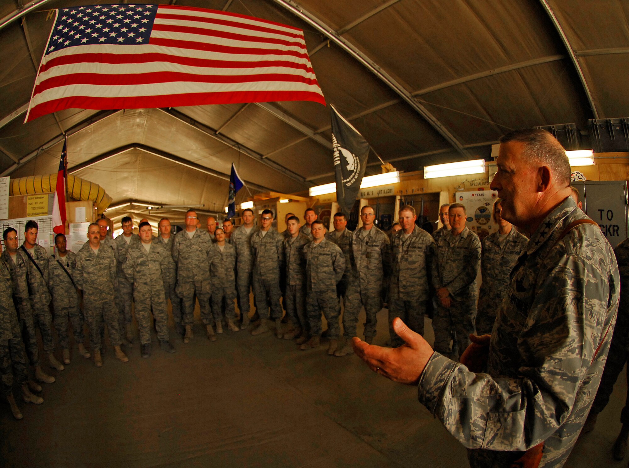 BAGRAM AIR FIELD, Afghanistan - Lt. Gen. Gary North, U.S. Air Forces Central and 9th Air Force commander, talks with dozens of C-130 crew members, maintainers and support staff during a visit to Bagram Air Field's C-130 maintenance hangar June 16. General North visited and spoke with hundreds of Airmen as he prepares for his final month as commander after serving more than three years. (Air Force/Staff Sgt. Jason Lake)