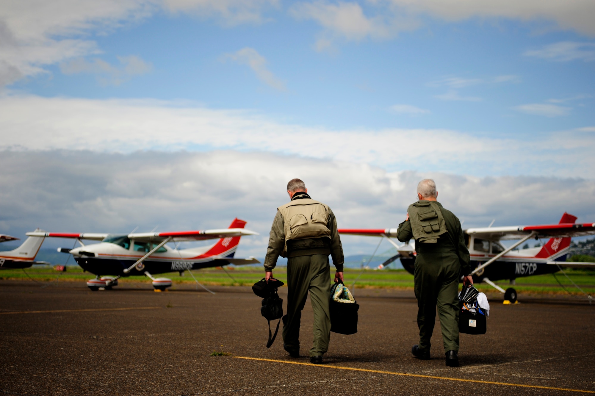 Lt. Col. Wayne Schulz (left) and Capt. John Barringer, U.S. Air Force Auxiliary, Civil Air Patrol, step to a C-182 Cessna before departing Astoria, Ore., during Amalgam Dart 2009, June 18. Amalgam Dart is a field test of the Department of Defense's ability to rapidly deploy a total air integrated defense system in the U.S. in order to deter, detect and defeat airborne threats. (U.S. Air Force photo by Staff Sgt. Jacob N. Bailey)
