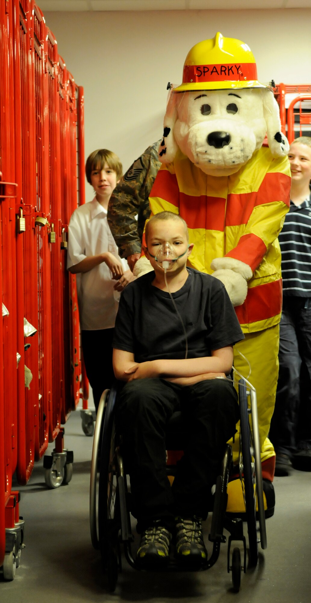 Liam Fairhurst, 14, visits the RAF Mildenhall Fire Station as part of courtesy tour June 16.  Both RAF Mildenhall and RAF Lakenheath have actively participated in several fundraisers Fairhurst has conducted for Cancer Leukemia in Children and Sargent Cancer Care for Children. The organization - also called CLIC Sargent - is a group that helps children with cancer. Fairhurst has raised more than 320,000 pounds for his efforts during the last several years.  (U.S. Air Force photo by Staff Sgt. Christopher L. Ingersoll)