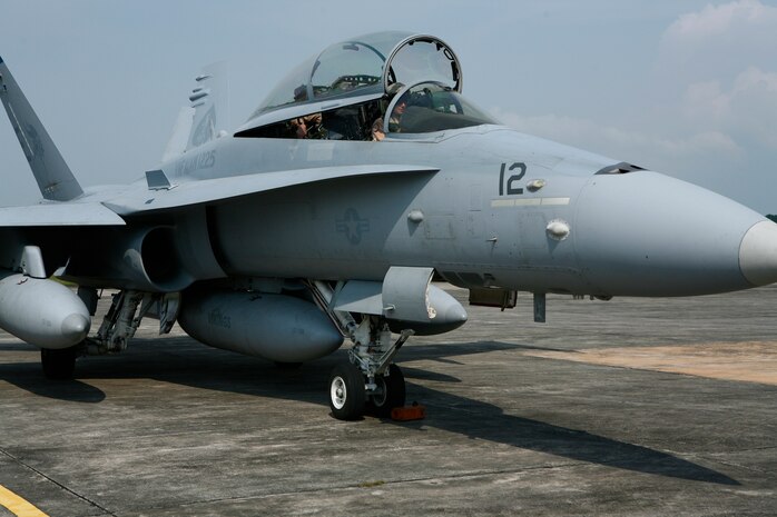 The last Marine All-Weather Fighter Attack Squadron 225 F/A-18 participating in exercise Air Warrior 2009, a multi-lateral exercise demonstrating joint and multinational capabilities, and improving interoperability between the United States and Malaysia, completes its taxi process upon arrival here from Marine Corps Air Station Iwakuni, Japan June 22. VMFA(AW)-225 pilots in F/A-18s will take to the skies over the next week against a Malaysian squadron of Mikoyan MiG-29s during the exercise.