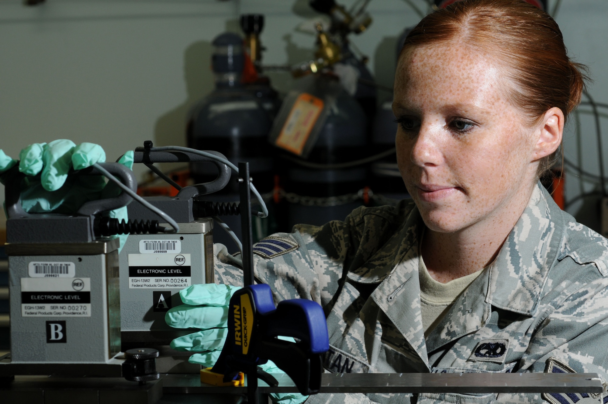 YOKOTA AIR BASE, Japan -- Senior Airman Jade Montan, 374th Maintenance Squadron Precision Measurement Equipment Laboratory technician, calibrates a surface plate which is used as the main horizontal reference plane for precision inspection June 23. PMEL technicians perform and manage repairs on test, measurement, and diagnostic equipment. (U.S. Air Force photo/ Staff Sgt. Veronica Pierce)