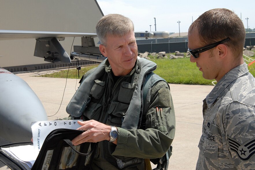 Lt. Gen. Jeffrey A. Remington, 7th Air Force Commander, reviews the forms of his F-16 Fighting Falcon with Staff Sgt. Andrew Pechanec, 8th Aircraft Maintenance Squadron crew chief, at Kunsan Air Base, Republic of Korea, June 23. This is the final flight that General Remington will have with the Wolf Pack as the 7th Air Force Commander. (U.S. Air Force Photo by SSgt Jason Colbert)





