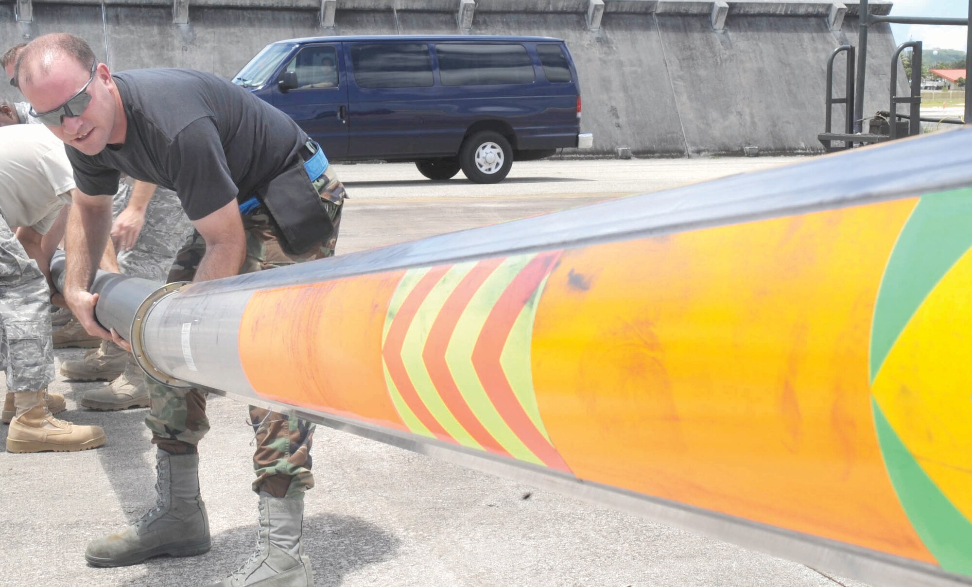 Tech. Sgt. Eugene Skelton, a lead mechanic hydraulic technician deployed from the 452nd MXS at March ARB, helps remove the air refueling boom. (U.S. Air Force Photos by Senior Airman Christopher Bush)