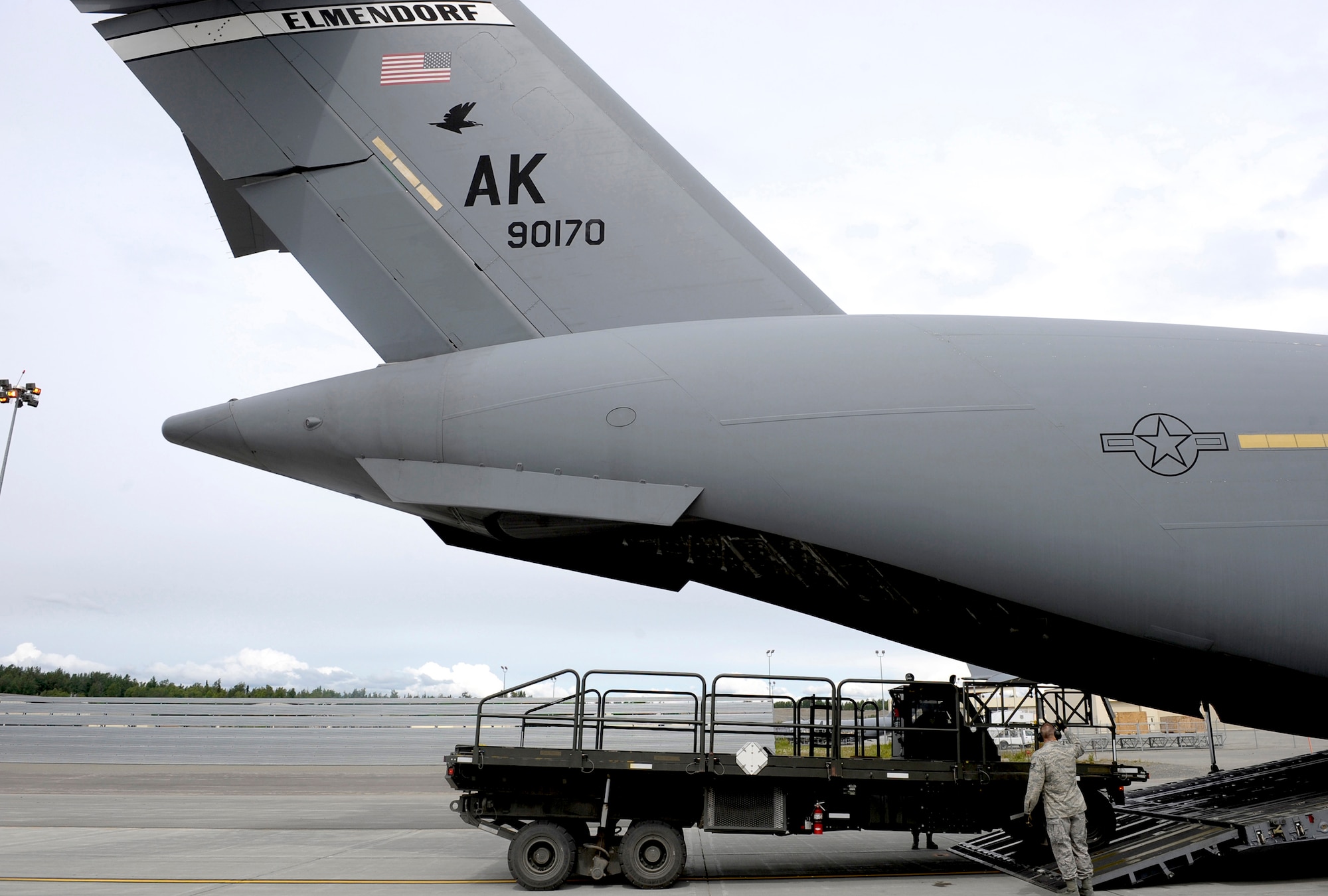 ELMENDORF AIR FORCE BASE, Alaska -- Members of 3rd Logistics Readiness Squadron practice loading equipment on a 517th Airlift Squadron C-17 Globemaster III while preparing for the Air Mobility Command Rodeo at McChord Air Force Base, Wash., in July. The international competition focuses on readiness, and features airdrops, aerial refueling and other events which will showcase the unique and wide-ranging capabilities of military security forces, and aerial port, maintenance and aeromedical evacuation personnel. (U.S. Air Force photo/Master Sgt. Keith Brown)