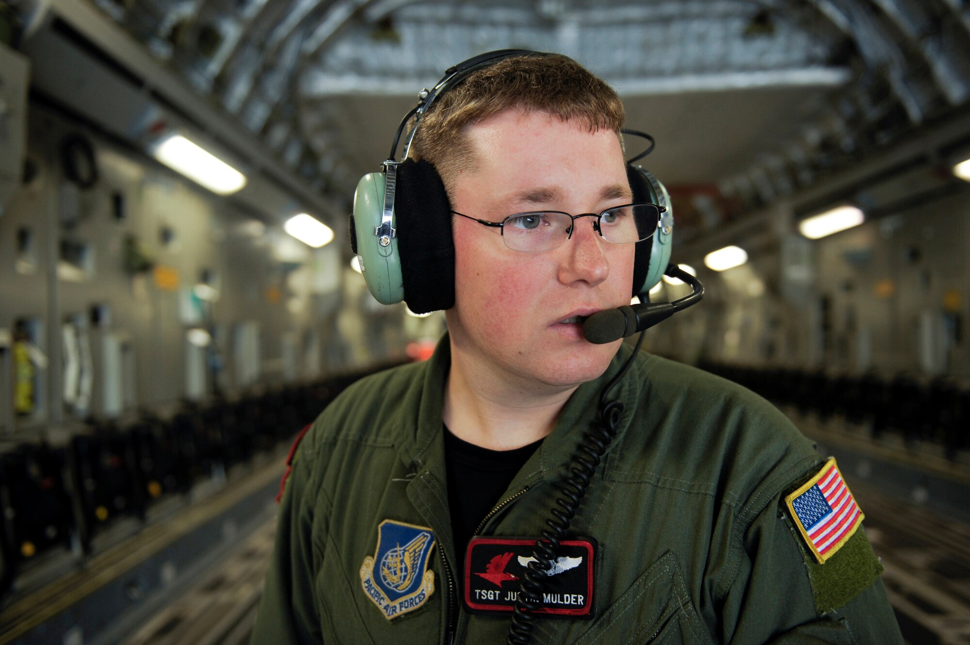 ELMENDORF AIR FORCE BASE, Alaska -- Tech. Sgt. Justin Mulder directs C-17 Globemaster III pilots who are backing up the aircraft during training for the upcoming Air Mobility Command Rodeo competition at McChord Air Force Base, Wash., in July. The international competition focuses on readiness, and features airdrops, aerial refueling and other events which will showcase the unique and wide-ranging capabilities of military security forces, and aerial port, maintenance and aeromedical evacuation personnel. Mulder is loadmaster with the 517th Airlift Squadron. (U.S. Air Force photo/Master Sgt. Keith Brown)