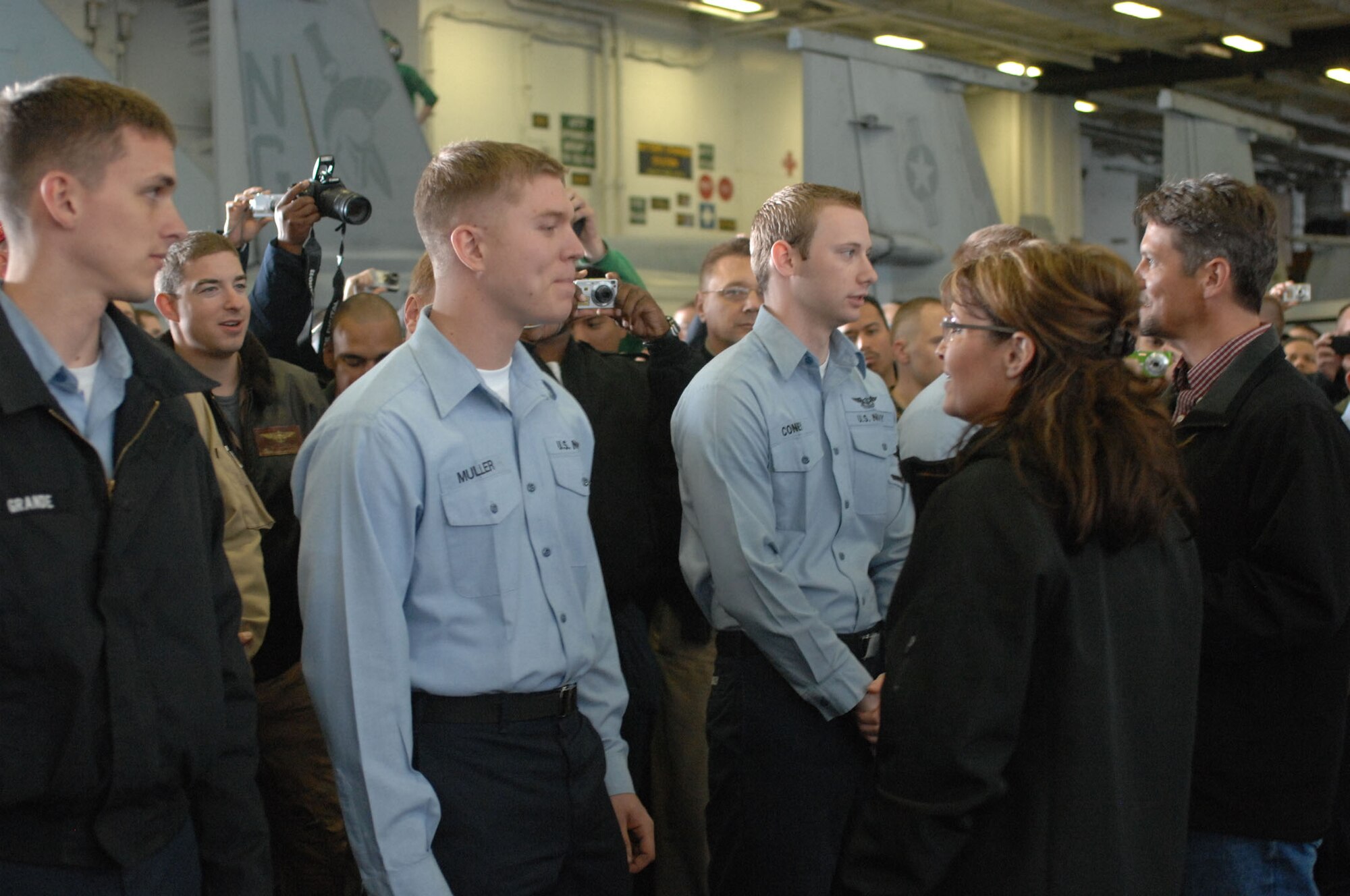 Alaskan Governor Sarah Palin greets Alaskan constituents inside the hanger bay of the aircraft carrier USS John C. Stennis (CVN 74) on Monday during the military joint-training exercise Northern Edge 2009 (Photo by Army Sgt. Ricardo Branch, Northern Edge Joint Information Bureau).