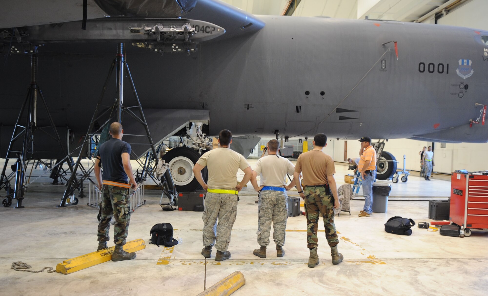 Airmen from the 2nd Expeditionary Aircraft Maintenance Unit watch as the landing gear is successfully tested on a B-52 Stratofortress bomber June 16.   The Airmen are deployed here from Barksdale Air Force Base, La., to support U.S. Pacific Command's Continuous Bomber Presence in the Asia-Pacific Region (U.S. Air Force photo/ Christopher Bush)
