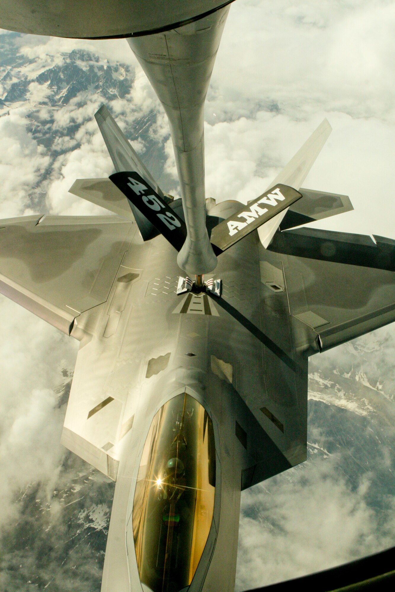 EIELSON AIR FORCE BASE, Alaska - An F-22 Raptor receives fuel from a KC-135 flown by pilots from the 168th Air Refueling Squadron stationed at Eielson Air Force Base during an aerial refueling mission June 19.. The mission was part of Exercise Northern Edge 2009, which prepares joint forces to respond to crises in the Asian Pacific region. During the mission, both F-22 and F-15 fighter jets received fuel. (United States Marine Corps photo by Lance Cpl. Ryan A. Rholes) 