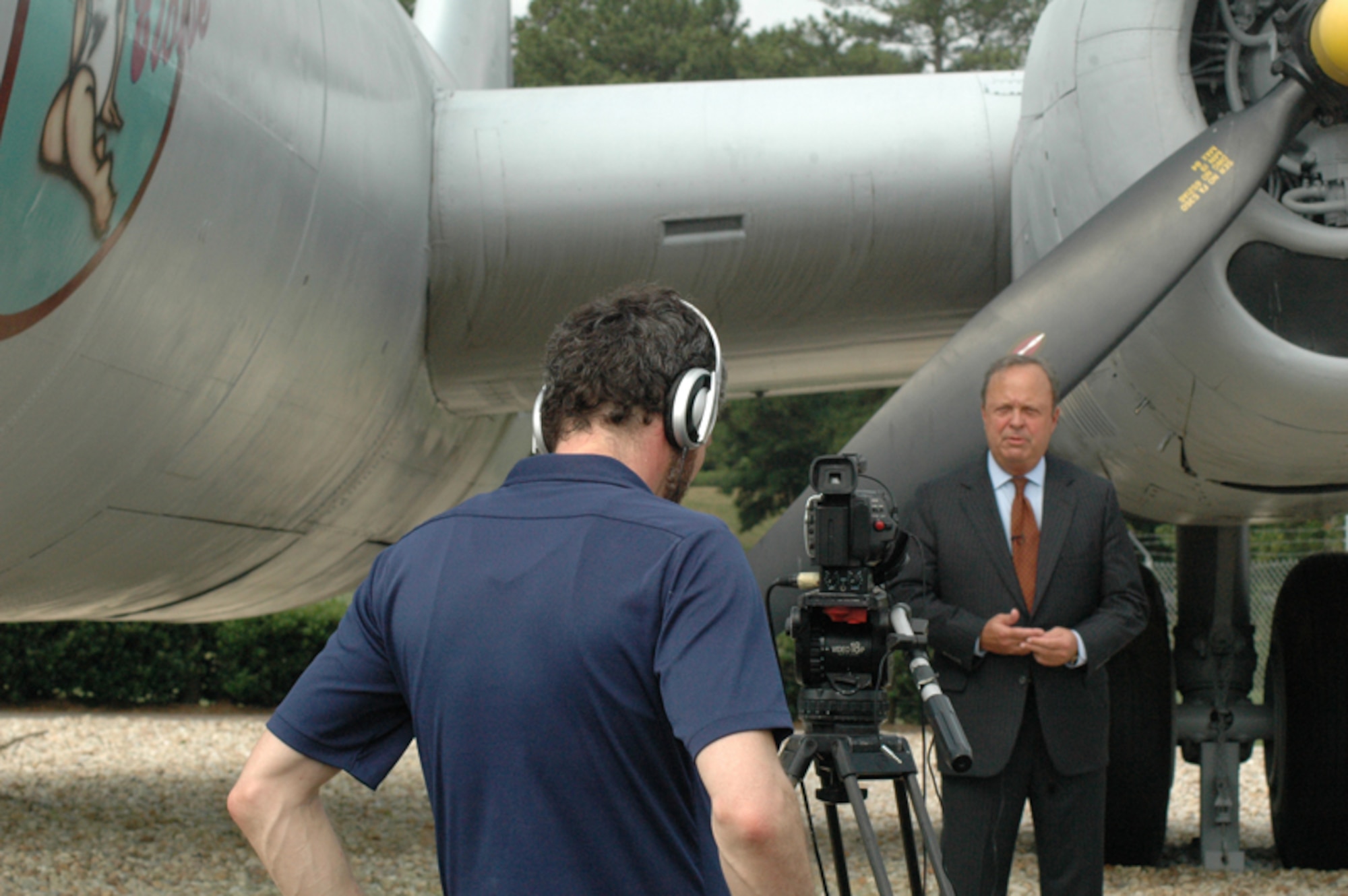 DOBBINS AIR RESERVE BASE, Ga. -- Tom Harrold, chairman of the 60th Berlin Airlift Anniversary Celebration Taskforce, tapes a documentary introduction in front of the historic B-29 Sweet Eloise at Dobbins Air Reserve Base June 19. The documentary highlights the Berlin Airlift 60th Anniversary commemoration held here May 15. (U.S. Air Force photo/Tech. Sgt. James Branch)