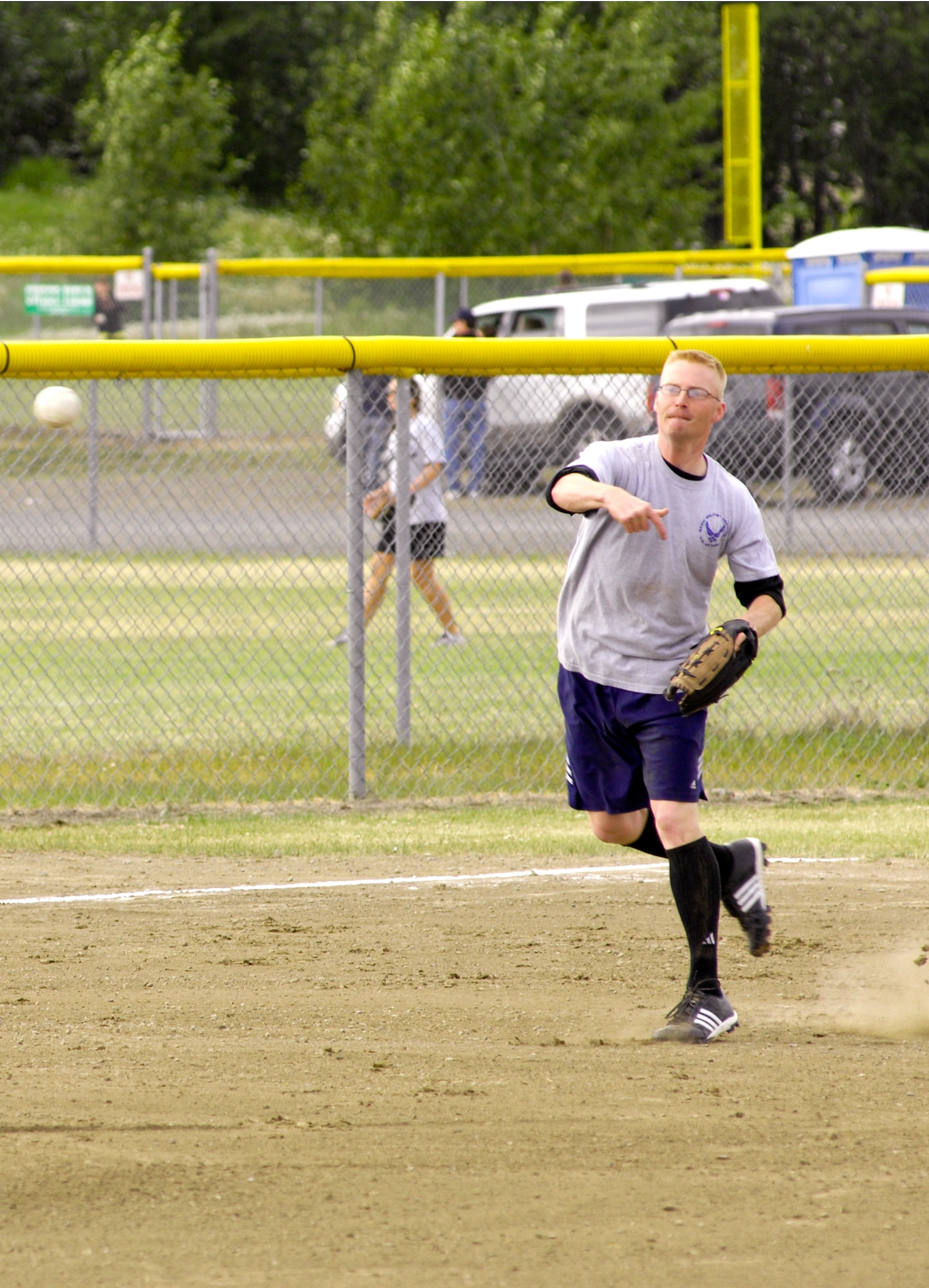 ELMENDORF AIR FORCE BASE, Alaska -- Gary Nicholson attempts to make the out at first base throwing across the diamond from third during the intramural softball game June 22. The 3rd Civil Engineer Squadron defeated the 3rd Equipment Maintenance Squadron team 17-7. Nicholson is a member of the  3rd EMS. (U.S. Air Force photo/Airman 1st Class Christopher Gross)