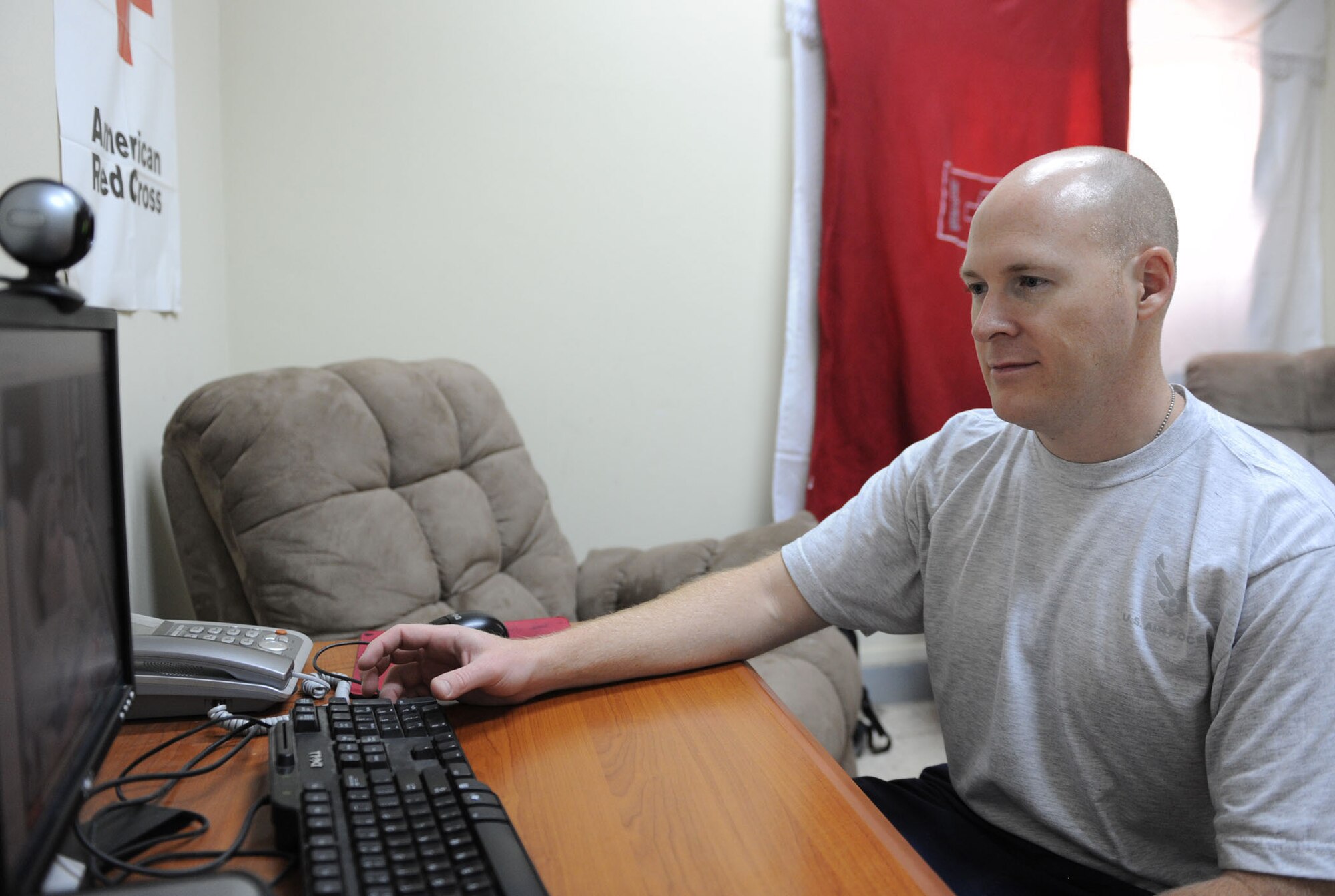 Tech. Sgt. Nathanael Farrington talks to his wife, Kristen, via Web cam June 17 from Joint Base Balad, Iraq. Sergeant Farrington watched his wife give birth to their third child, Madison. A native of Scottsdale, Ariz., Sergeant Farrington is a 332nd Expeditionary Operations Support Squadron weather forecaster and is deployed from Offutt Air Force Base, Neb. (U.S. Air Force photo/Senior Airman Tiffany Trojca)
