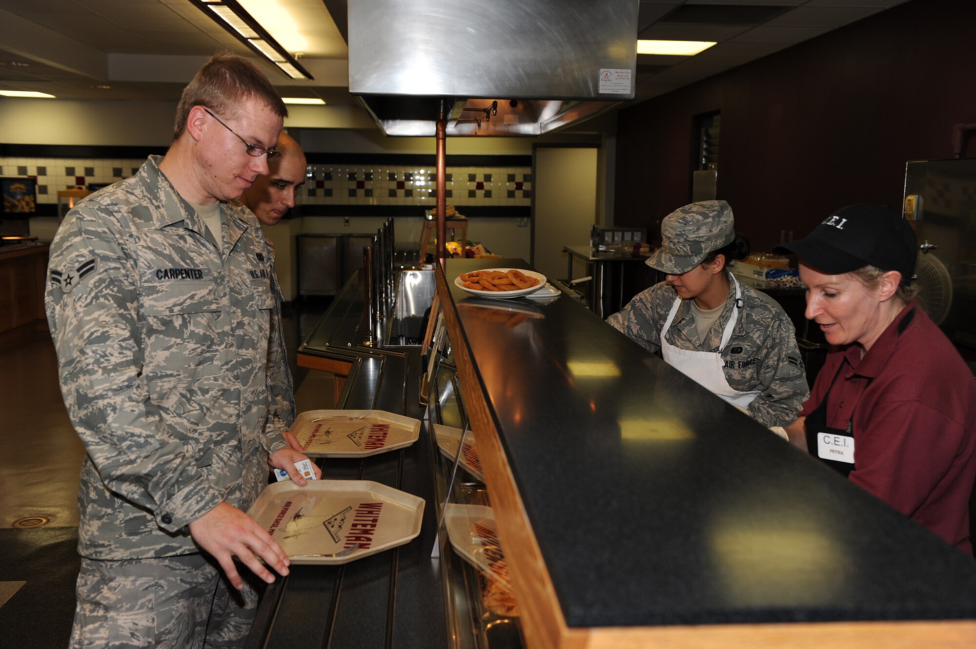 WHITEMAN AIR FORCE BASE, Mo. - Customers stand in line as they decide what they would like to eat from the Ozark Inn. The Ozark Inn has won the John L. Hennessy award for best in food service three consecutive years. (U.S. Air Force Photo/ Airman 1st Class Carlin Leslie)