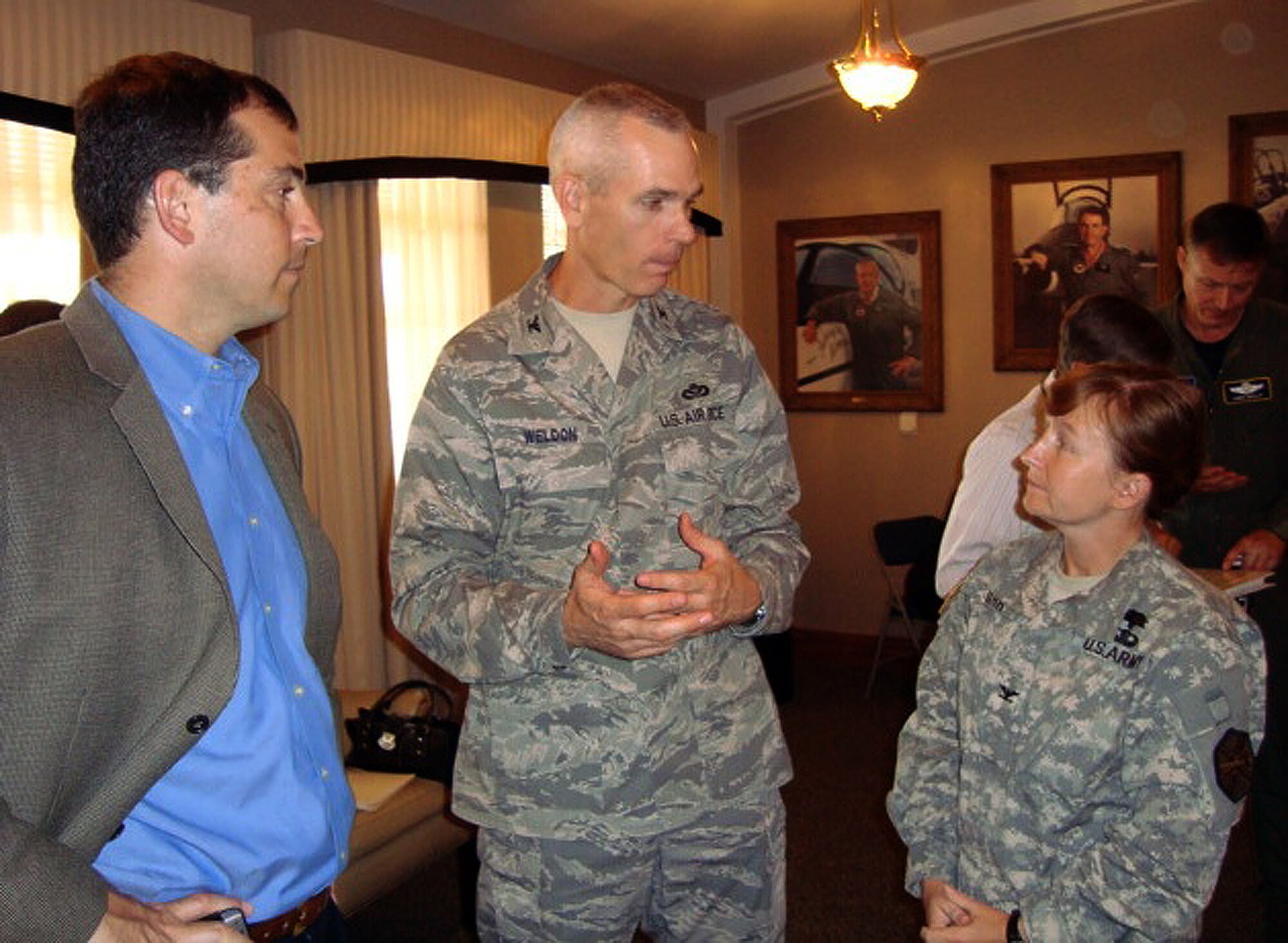Fort Sam Houston Garrison Commander Col. Mary Garr talks with Col. Kenny
Weldon, Office of the Secretary of Defense joint basing program manager, during the memorandum of agreement (MOA) review workshop June 9-11 at Randolph Air Force Base, Texas. Air Education and Training Command (AETC) hosted the workshop. (U.S. Air Force photo/Ron Rogers)
