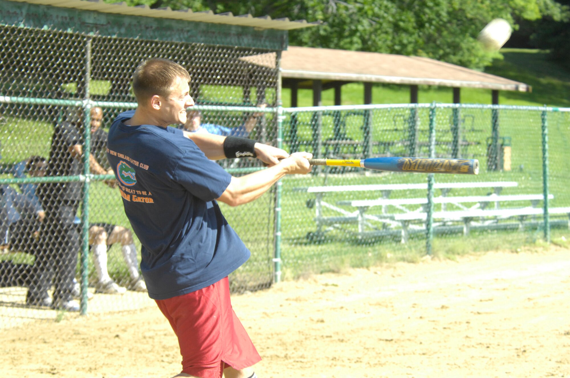 Capt. Mike Elliot, 66th Medical Operations Squadron, makes contact with the ball during a June 16 exhibition softball game between the Hanscom Company Grade Officers and a team composed of Hanscom's Top Three and colonels. The 9-inning game, held at Hanscom's Field 4, ended in an draw after the Top Three and colonels scored 16 runs in the final three innings to even the score at 16.  (U.S. Air Force photo by Mark Herlihy)