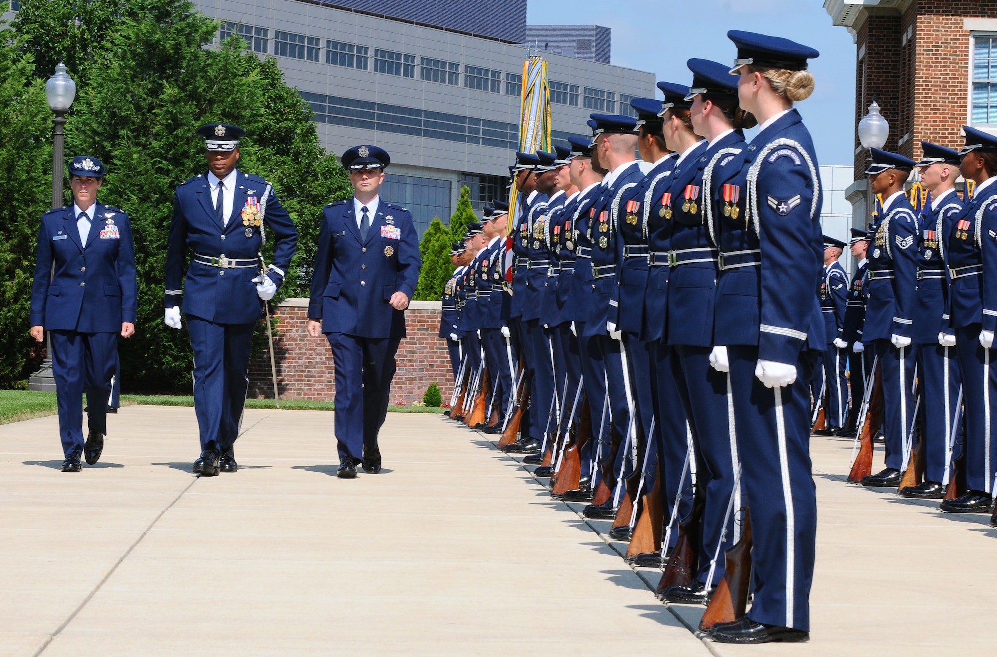 Maj. Tyson Willis, U.S. Air Force Honor Guard director of operations, leads Col. Elizabeth Borelli, 11th Operation Group commander, and Lt.  Col. Raymond M. Powell, U.S. Air Force Honor Guard commander, during an inspection of the troops as part of the Air Force Honor Guard change-of-command ceremony June 23 on the U.S. Air Force Ceremonial Lawn, Bolling Air Force Base, D.C. These ceremonies represent the formal passing of responsibility, authority and accountability of command from one officer to another. (U.S. Air Force photo by Senior Airman Alex Montes)