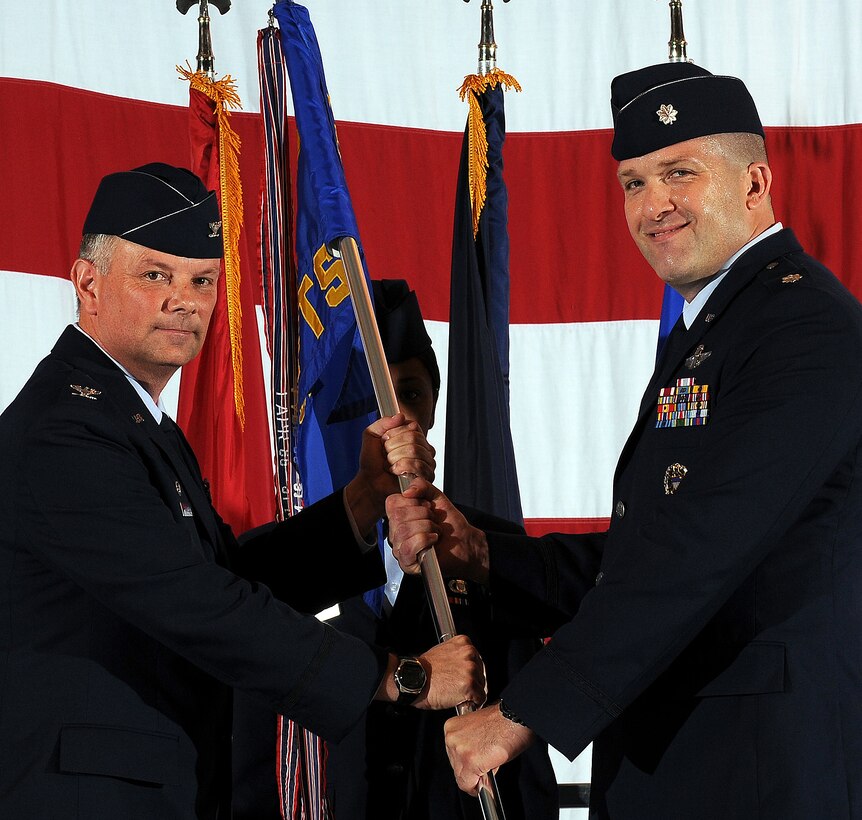 Lt. Col. James Gifford, right, accepts command of the 8th Flying Training Squadron from Col. Glen VanHerck, 71st Operations Group commander, during a ceremony held June 19 in Hangar 170. Colonel Gifford previously served as the 8th FTS director of operations. He replaced Navy Cmdr. Roger Curry, who was reassigned as the navigator onboard the aircraft carrier USS Theodore Roosevelt. (U.S. Air Force photo/Rachel Boettcher)