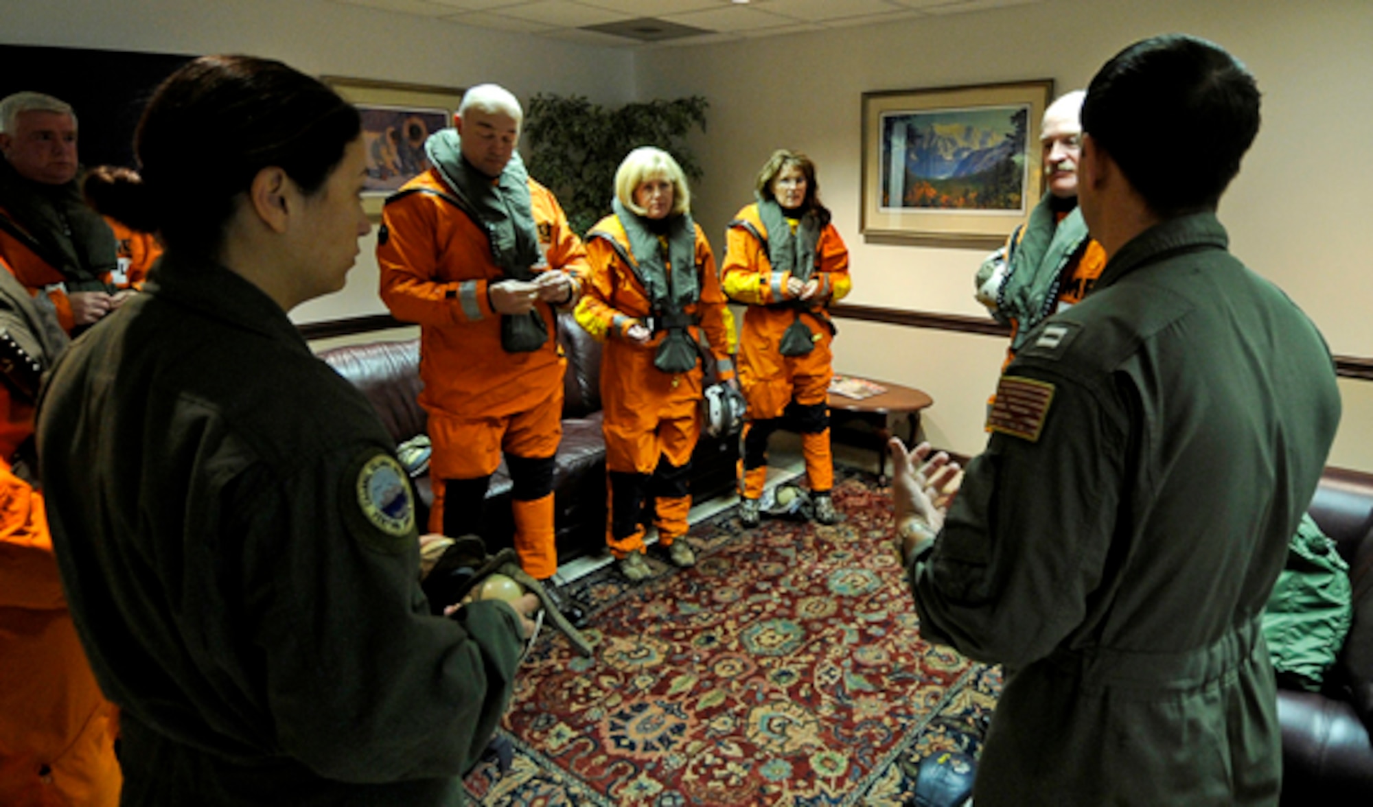 Navy personnel from a C-2A Greyhound logistics aircraft give Alaska Governor Sarah Palin and her husband Todd a safety briefing before getting on the aircraft that will be taking them out to USS John C. Stennis (CVN 74) during exercise Northern Edge 2009, Elmendorf AFB, Alaska, June 18, 2009.  Northern Edge 2009 is Alaska's largest military training exercise.  It prepares joint forces to respond to crises throughout the Asia-Pacific region.  (Released/U.S. Air Force photo by TSgt Dennis J. Henry Jr.)