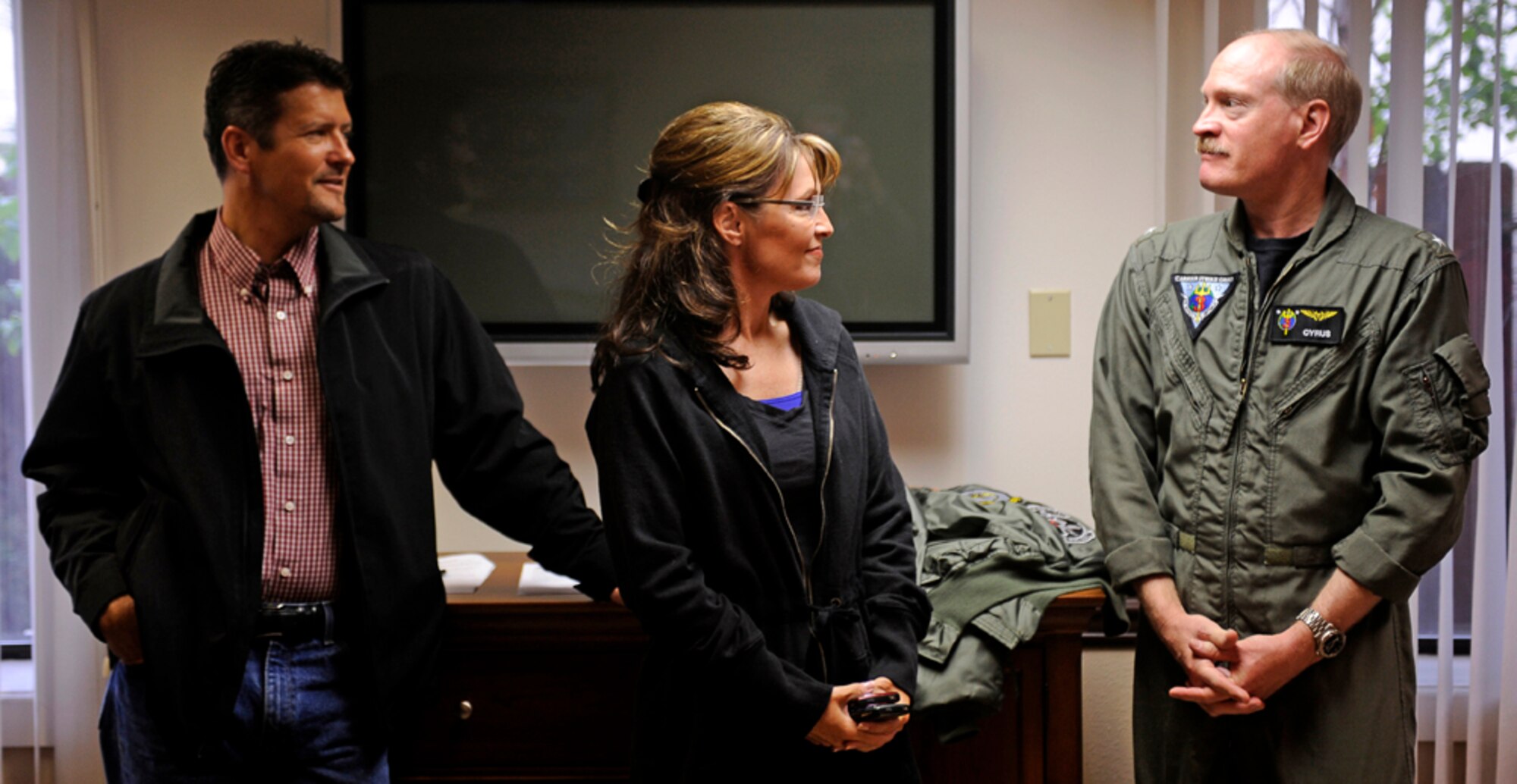 Alaska Governor Sarah Palin and her husband Todd meet with Rear Admiral Mark A. Vance, USS John C. Stennis (CVN 74) Strike Group Commander, before loading onto a C-2A Greyhound logistics aircraft  that will be taking them out to USS John C. Stennis (CVN 74) during exercise Northern Edge 2009, Elmendorf AFB, Alaska, June 18, 2009.  Northern Edge 2009 is Alaska's largest military training exercise.  It prepares joint forces to respond to crises throughout the Asia-Pacific region.  (Released/U.S. Air Force photo by TSgt Dennis J. Henry Jr.)
