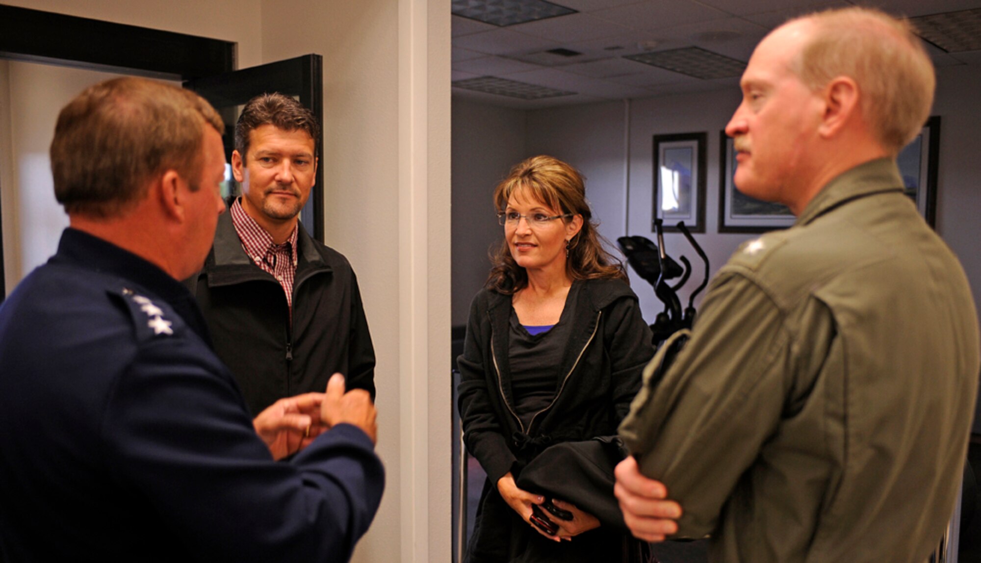 Alaska Governor Sarah Palin and her husband Todd meet with Lt. Gen. Dana T. Atkins, Alaskan Command Commander, 11th Air Force; and Rear Admiral Mark A. Vance, USS John C. Stennis (CVN 74) Strike Group Commander, before heading out to the USS John C. Stennis (CVN 74) during exercise Northern Edge 2009, Elmendorf AFB, Alaska, June 18, 2009.  Northern Edge 2009 is Alaska's largest military training exercise.  It prepares joint forces to respond to crises throughout the Asia-Pacific region.  (Released/U.S. Air Force photo by TSgt Dennis J. Henry Jr.)