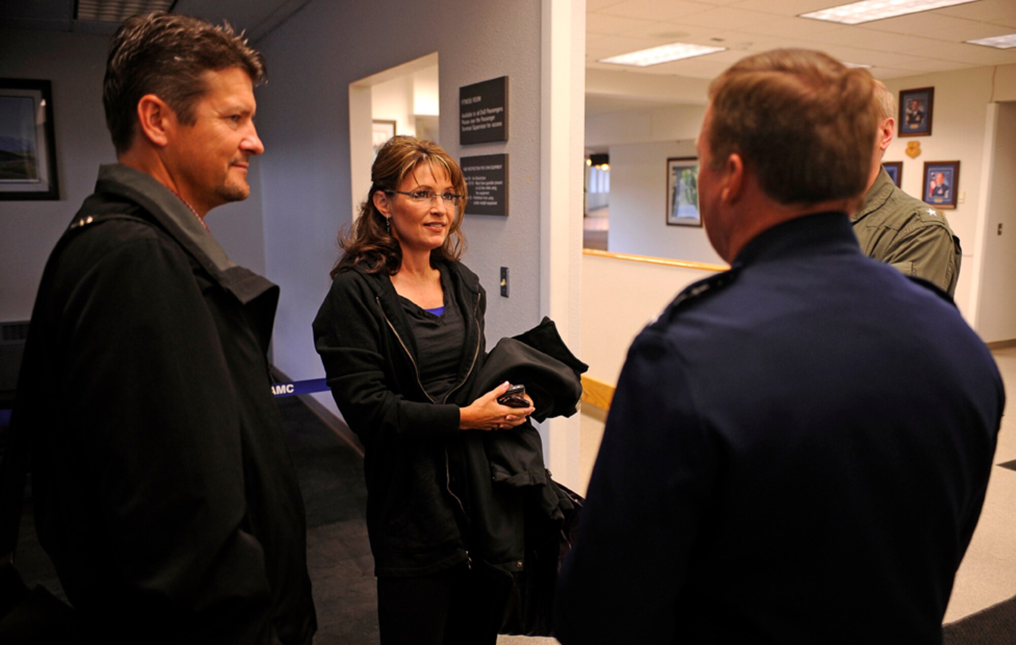 Alaska Governor Sarah Palin and her husband Todd meet with Lt. Gen. Dana T. Atkins, Alaskan Command Commander, 11th Air Force, and Rear Admiral Mark A. Vance, USS John C. Stennis (CVN 74) Strike Group Commander, before heading out to the USS John C. Stennis (CVN 74) during exercise Northern Edge 2009, Elmendorf AFB, Alaska, June 18, 2009.  Northern Edge 2009 is Alaska's largest military training exercise.  It prepares joint forces to respond to crises throughout the Asia-Pacific region.  (Released/U.S. Air Force photo by TSgt Dennis J. Henry Jr.)
