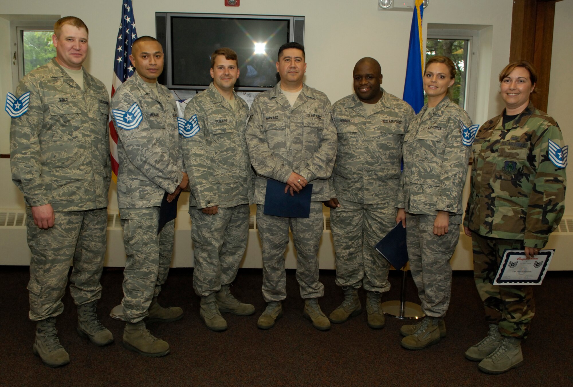 Seven newly promoted technical sergeants received their stripes during a promotion ceremony held at the Minuteman Club June 19. The promoted sergeants include, from left, Tech. Sgt. Robert Volz, 66th Medical Group; Tech. Sgt. Robert Mebane, 66th Comptroller Squadron; Tech. Sgt. Christopher Plourde, Joint Personal Property Shipping Office; Tech. Sgt. Juan Narvaez, 66 MDG; Tech. Sgt. William Herriott, 66 MDG; Tech. Sgt. Kristin Hays, 66 MDG and Tech. Sgt. Janet Stevens, 950th Electronic Systems Group.  (U.S. Air Force photo by Mark Herlihy)