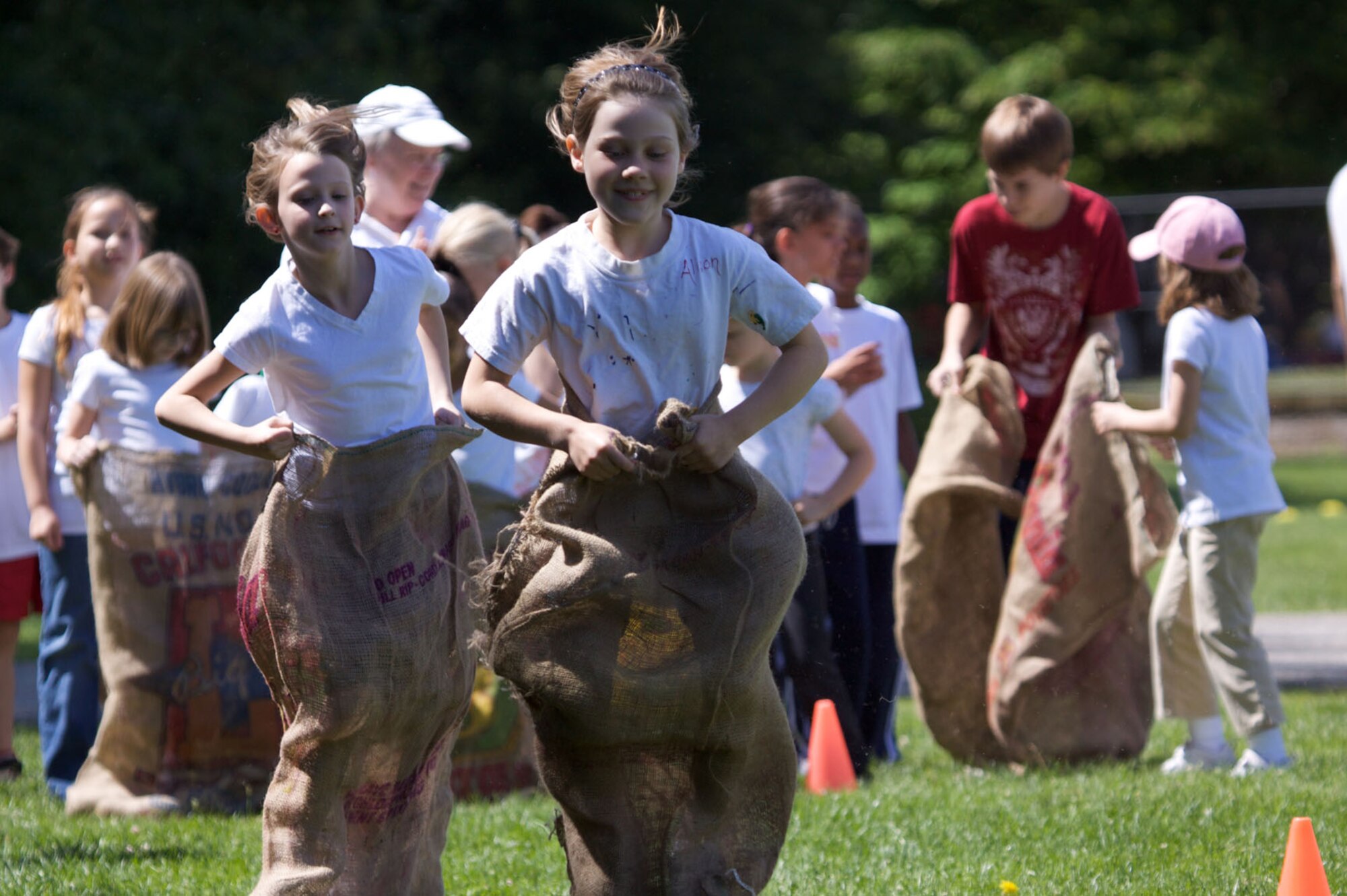 HANSCOM AIR FORCE BASE, Mass. –Hanscom Primary School students participate in a sack race during the school’s Field Day activities that took place June 17. (Photo by Lt. Col. Loralee Manas)
