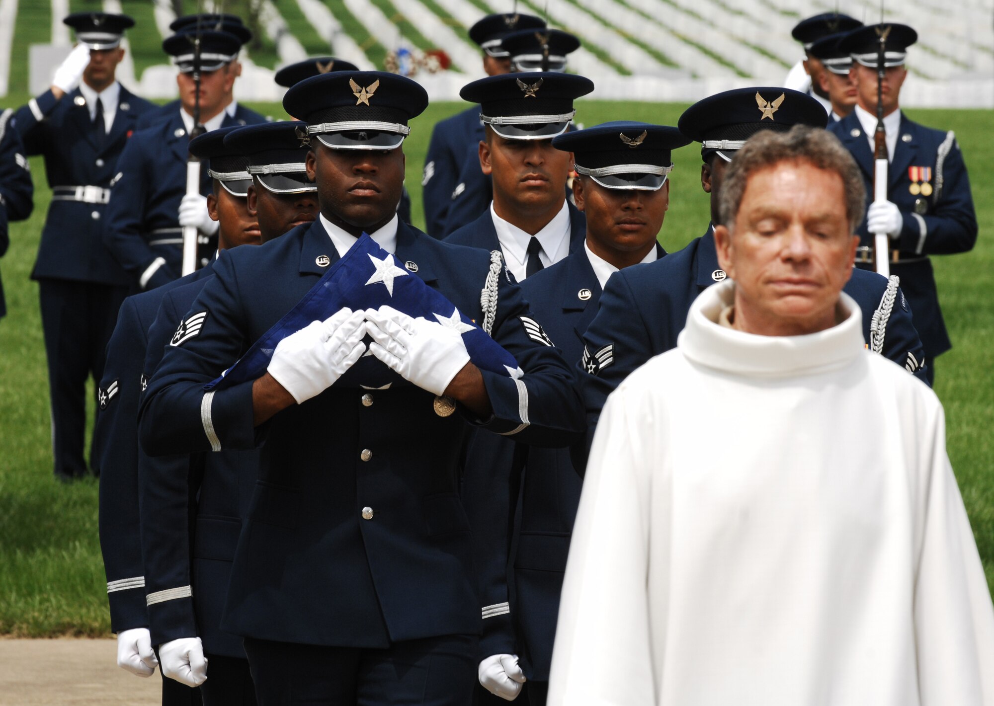 The United States Air Force Honor Guard carries the American flag preceding the ashes of Maj. Gen. David M. Jones during his funeral June 19 at Arlington National Cemetery, Va. The general served more than 40 years in the military, most notably as a member of the Doolittle Raiders and two and a half years as a prisoner of war. He was 94 years old when he passed away of heart failure at his home in Tucson, Ariz. Nov. 25, 2008. His military decorations and awards include the Legion of Merit, Distinguished Flying Cross with oak leaf cluster, Air Medal, Air Force Commendation Medal with oak leaf cluster, Purple Heart, Yum Hwei from the Chinese Government, the NASA Exceptional Service Medal with device, and the NASA Distinguished Service Medal. (U.S. Air Force photo by Senior Airman Alex Montes)