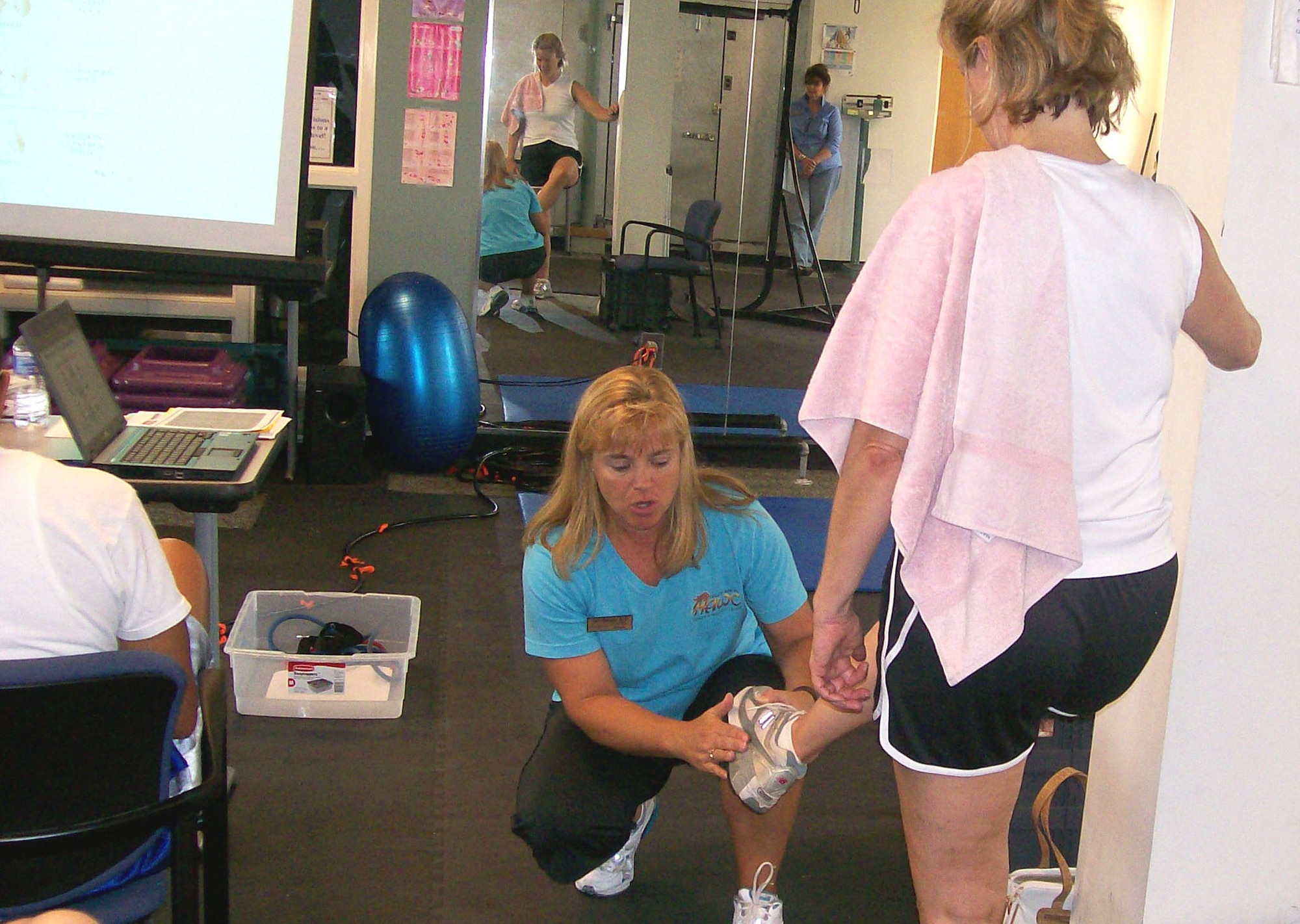 DUKE FIELD, Fla. -- Andrea Moneymaker, an Eglin AFB Health and Wellness Center health and fitness instructor, demonstrates proper running shoe fit during the recent "Healthy You Day" at the Duke Fitness Center.  The program offered reservists a wealth of helpful information on maintaning good health and fitness, including sessions on cholesterol testing, injury prevention, nutrition and more. (U.S. Air Force photo/James Brock III).