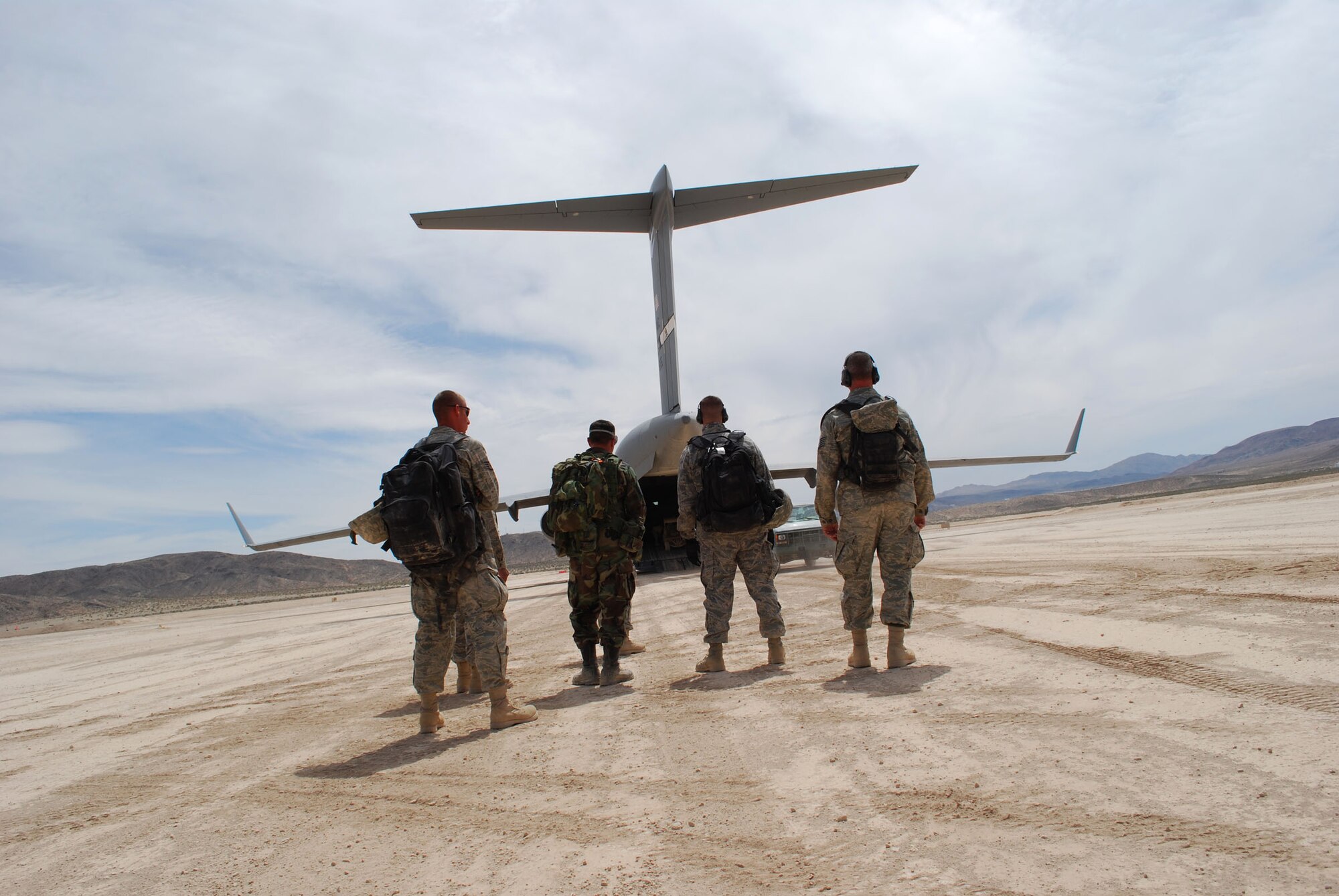 An airfield assessment team from the 615th Contingency Response Wing prepares to depart Bicycle Lake at Fort Irwin, Calif., June 15 for Travis Air Force Base, Calif., after completing their surveys at one of the four HYDRA locations throughout California.  HYDRA is a joint, total force training venue hosted annually by the 615th CRW. (U.S. Air Force photo/1st Lt. Nicole Langley)