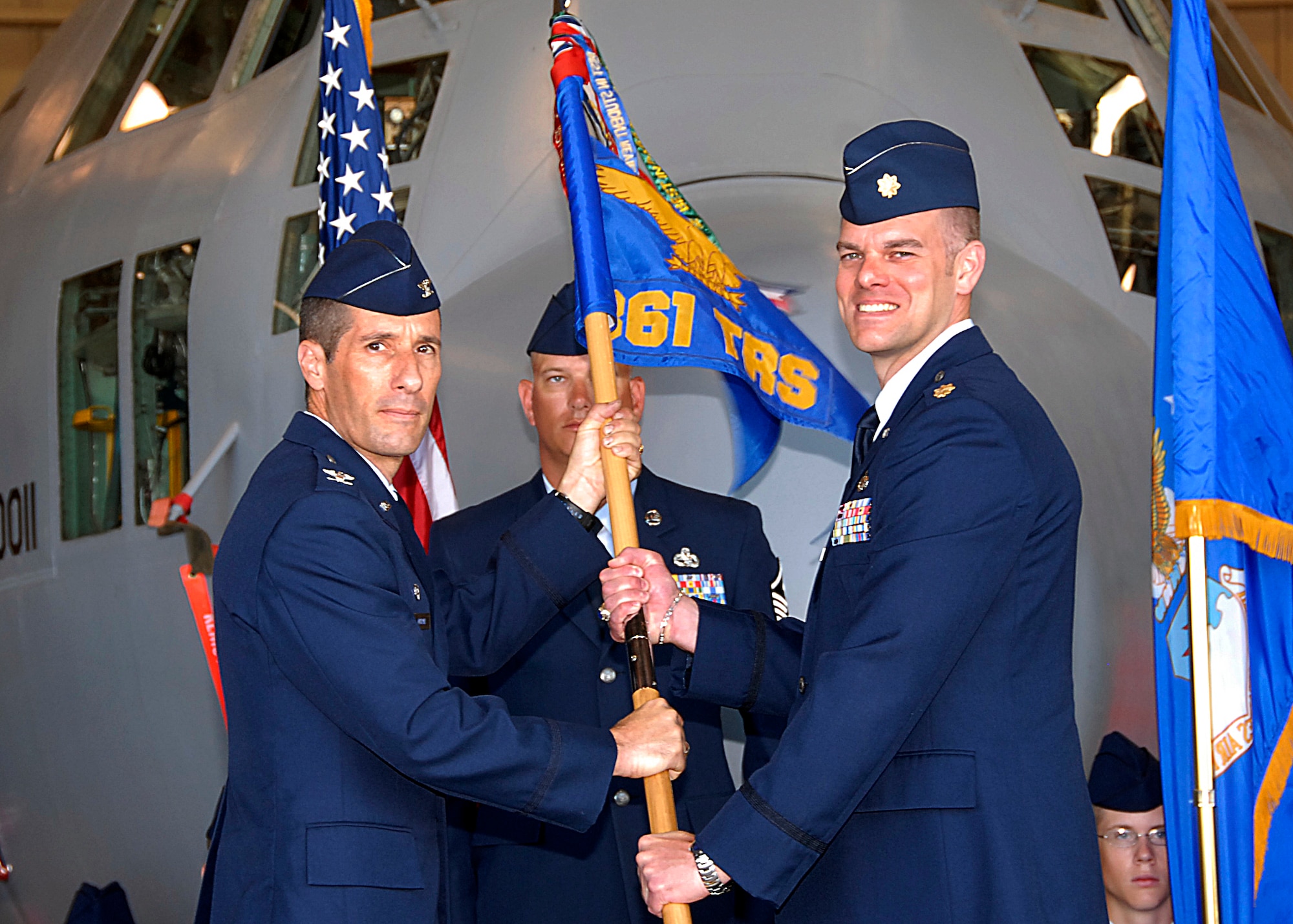 Maj. Scott Graham takes the 361st Training Squadron guidon June 22 from Col. Steven Morani, the 82nd Training Group commander. Major Graham replaced Lt. Col. Kelly Scott during the change of command ceremony. (U.S. Air Force photo/Harry Tonemah) 