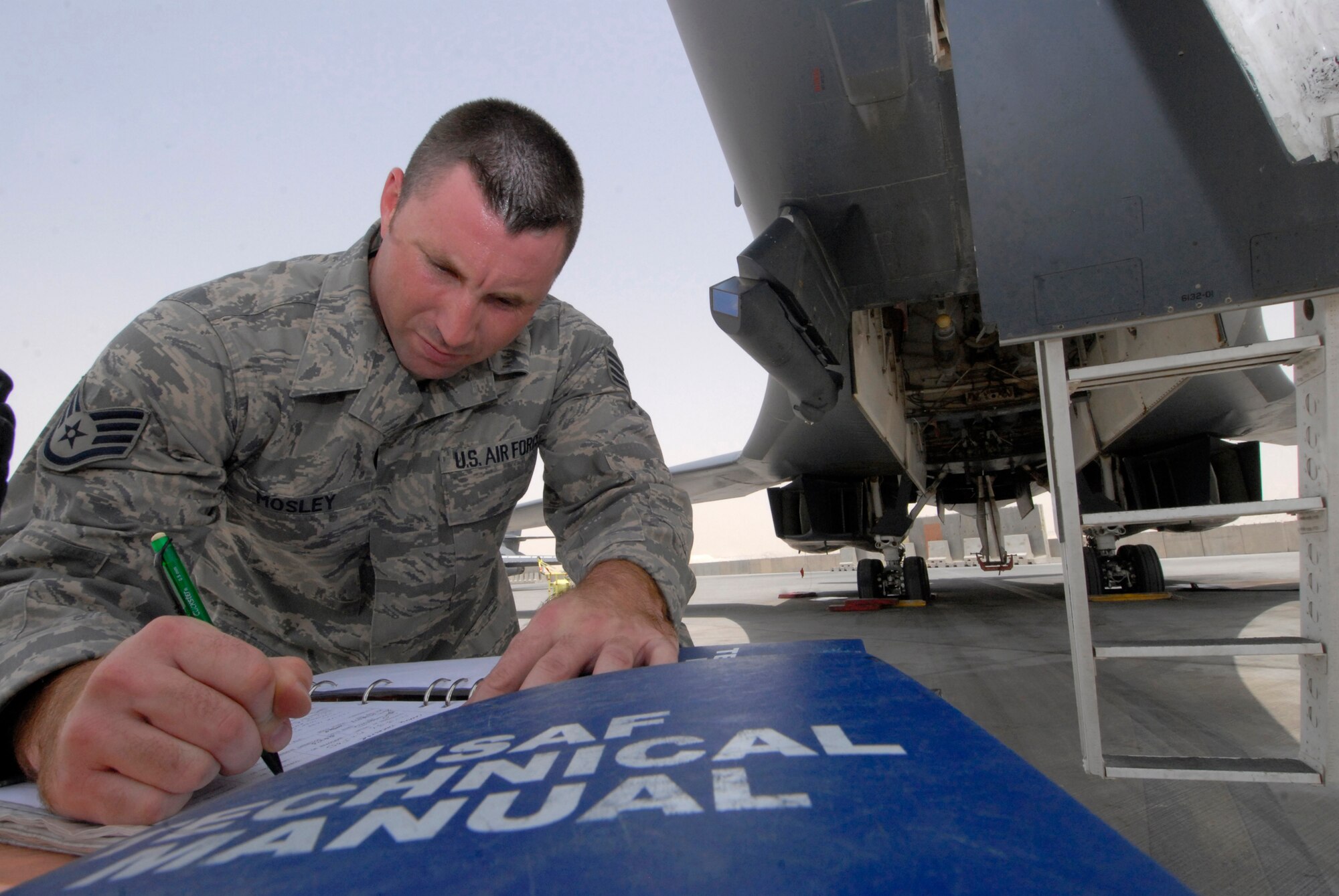 Staff Sgt. Christopher Mosley, 379th Expeditionary Maintenance Squadron aircrew egress systems section chief, fills out the forms for his inspection on the seat retractor thrusters on a B1-B Lancer ejection seat, June 18, 2009, at an undisclosed location in Southwest Asia.  The ejection system is inspected to ensure the crew can safely eject out the aircraft in an emergency where the plane is in a terminal condition.  The ejection system can launch a 300 lb. individual 200 feet in the air and deploy a parachute in 1.8 seconds.  Sergeant Mosley hails from Savannah, Ga. and is deployed from Dyess Air Force Base, Texas, in support of Operations Iraqi and Enduring Freedom and Combined Joint Task Force - Horn of Africa.  (U.S. Air Force photo/Senior Airman Andrew Satran/released)