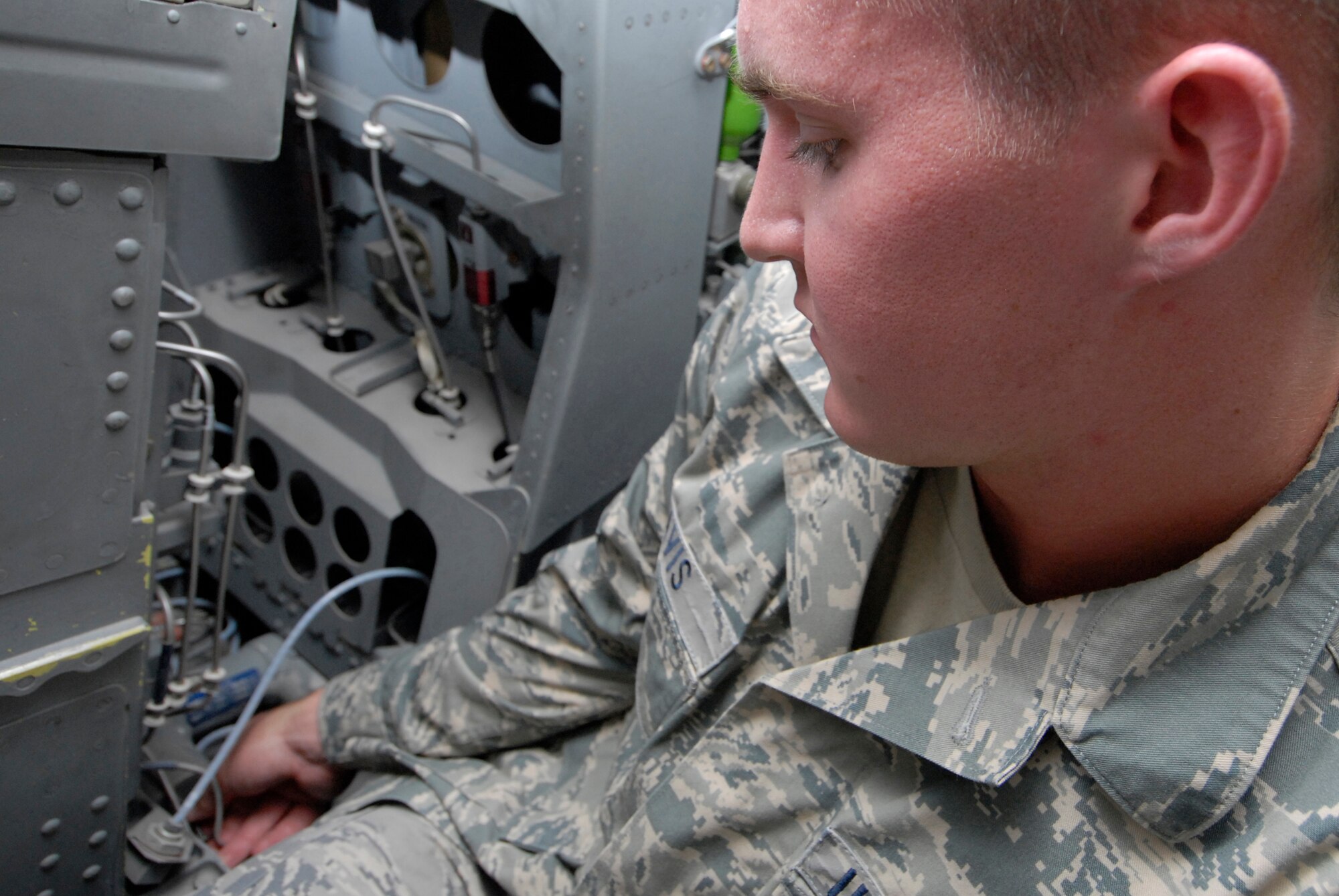 Senior Airman Zachary Davis, a 379th Expeditionary Maintenance Squadron aircrew egress systems journeyman, uses a pre-measured bolt to check the bellows depth for the seat carrier retract thrusters during his inspection on the ejection seat of a B1-B Lancer, June 18, 2009, at an undisclosed location in Southwest Asia.  The seat retract thruster is a system that will reposition the seat during an ejection.  The ejection system is inspected to ensure the pilots can safely eject out the aircraft in an emergency where the plane is in a terminal condition.  The system can launch a 300 lb. individual 200 feet in the air and deploy a parachute in 1.8 seconds.  Airman Davis hails from San Andreas, Calif. and is deployed from Dyess Air Force Base, Texas, in support of Operations Iraqi and Enduring Freedom and Combined Joint Task Force - Horn of Africa.  (U.S. Air Force photo/Senior Airman Andrew Satran/released)