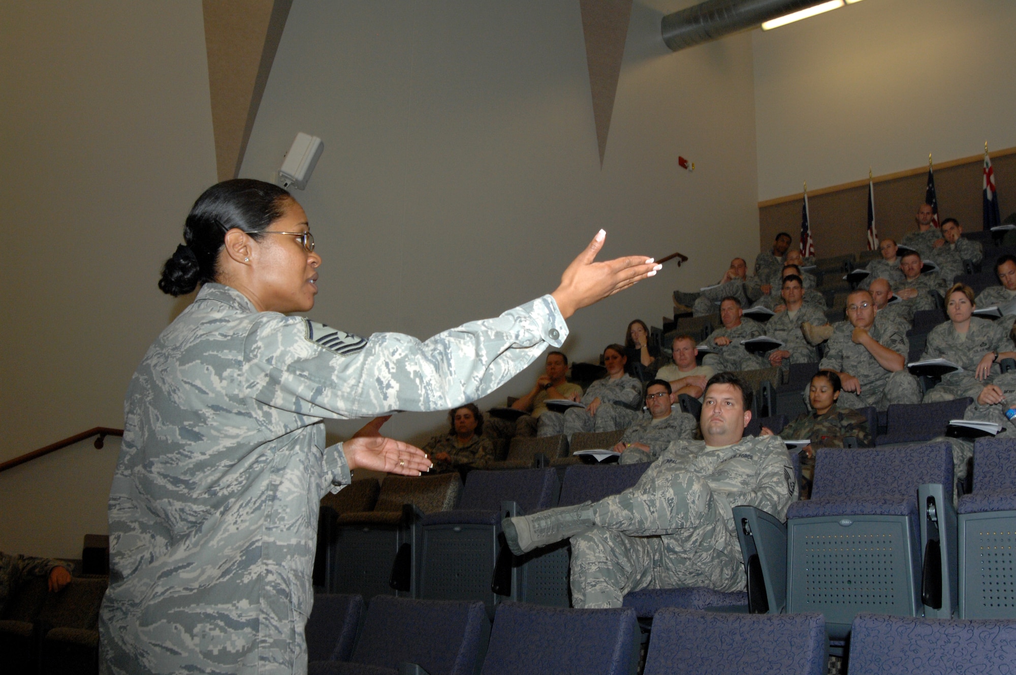 WHITEMAN AIR FORCE BASE, Mo. - Master Sgt. Mauree Powell, First Sergeant Academy instructor at Maxwell AFB, Ala., briefs additional duty 1st Sgts. on following the correct processes regarding administrative actions. A symposium for additional duty first sergeants was conducted June 15-19 to provide instruction for additional duty first sergeants at Whiteman.  Sixty master and technical sergeants from various bases received instruction that was condensed from a three-week course to a five-day instruction.  (U.S. Air Force photo/Master Sgt. Stan Coleman)